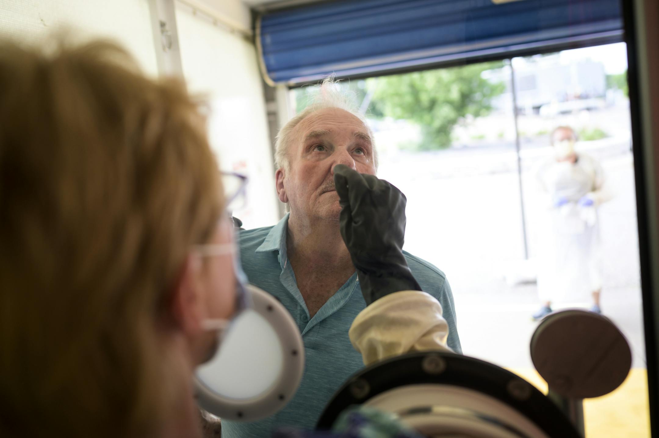 Albert Gartman, 84, of Forest Lake, was tested for COVID-19 by medical assistant Jeri Sanderson, at M Health Fairview's Wyoming Clinic.