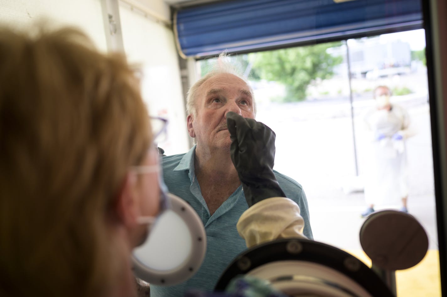 Albert Gartman, 84, of Forest Lake, was tested for COVID-19 by medical assistant Jeri Sanderson, at M Health Fairview's Wyoming Clinic.