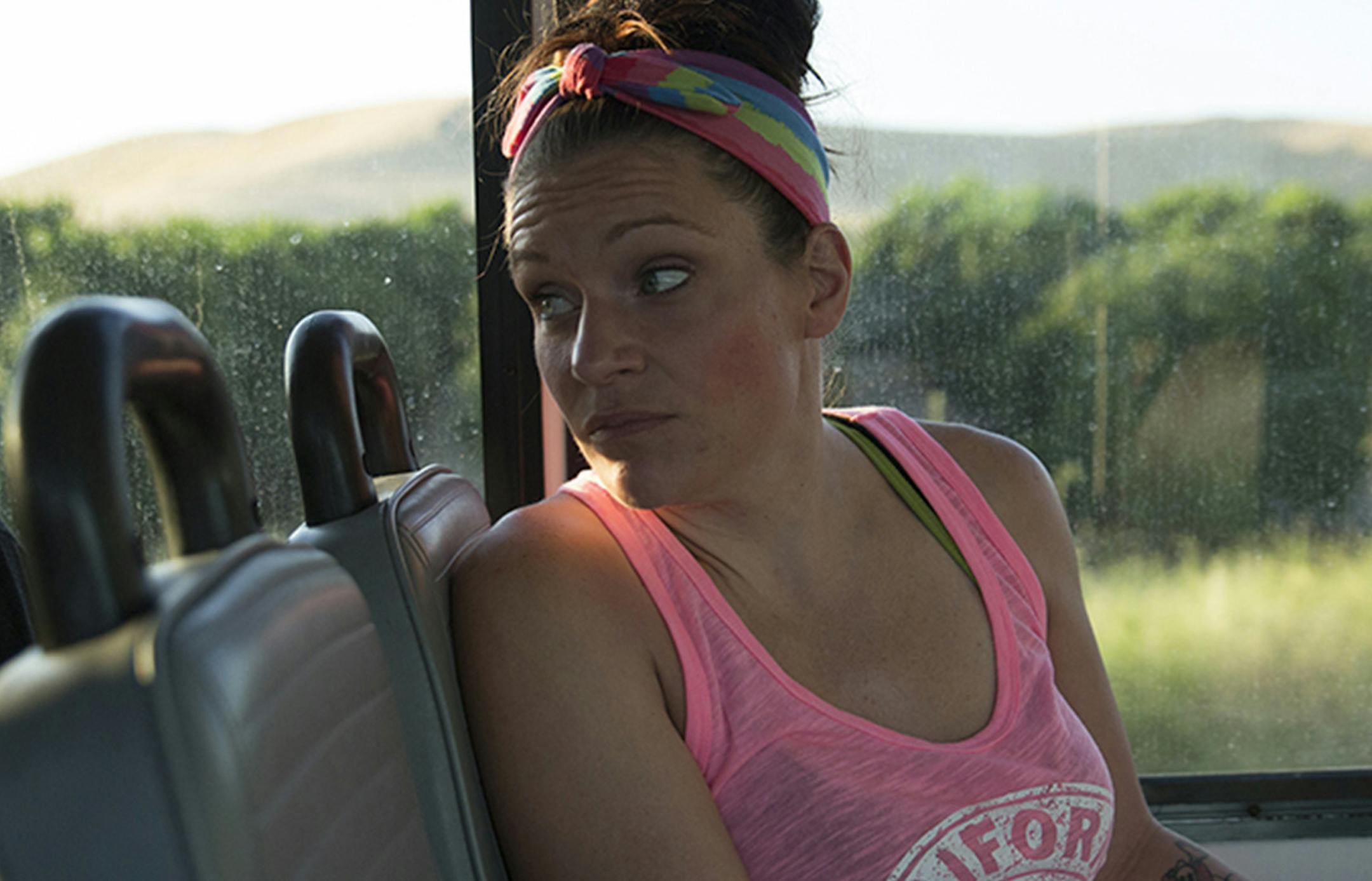 Heather Menzel rides the 6 a.m. bus to Bakersfield, Calif., en route to a methadone clinic on June 6, 2016. (Brian Rinker for KHN)