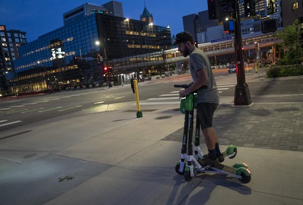 Andy Emerson rode three of the Lime scooters that he "harvested" for overnight "juicing."
