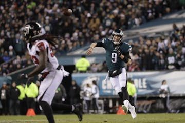 Philadelphia Eagles' Nick Foles passes during the first half of an NFL divisional playoff football game against the Atlanta Falcons, Saturday, Jan. 13