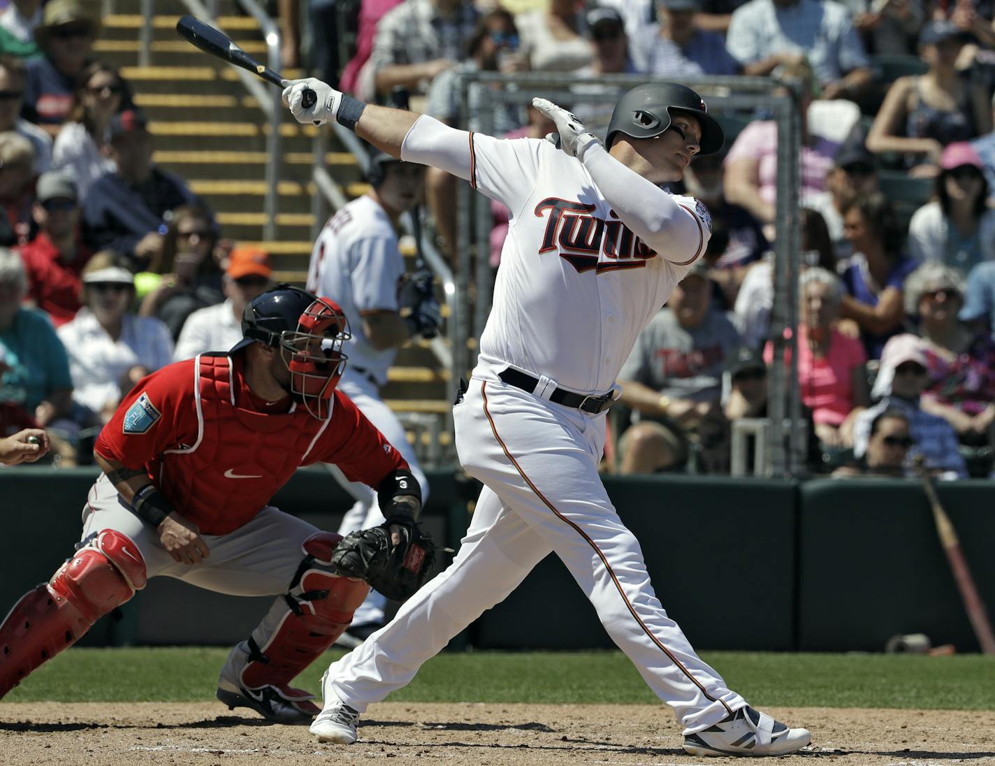 FILE - In this Wednesday, March 14, 2018, file photo, Minnesota Twins' Logan Morrison strikes out against Boston Red Sox starting pitcher Chris Sale during the second inning of a spring training baseball game, in Fort Myers, Fla. The Minnesota Twins were already on the upswing after reaching the AL wild card game last year behind a lot of young talent. They took another major step forward this offseason with a series of low-risk upgrades to the bullpen, the rotation and the lineup with the poten