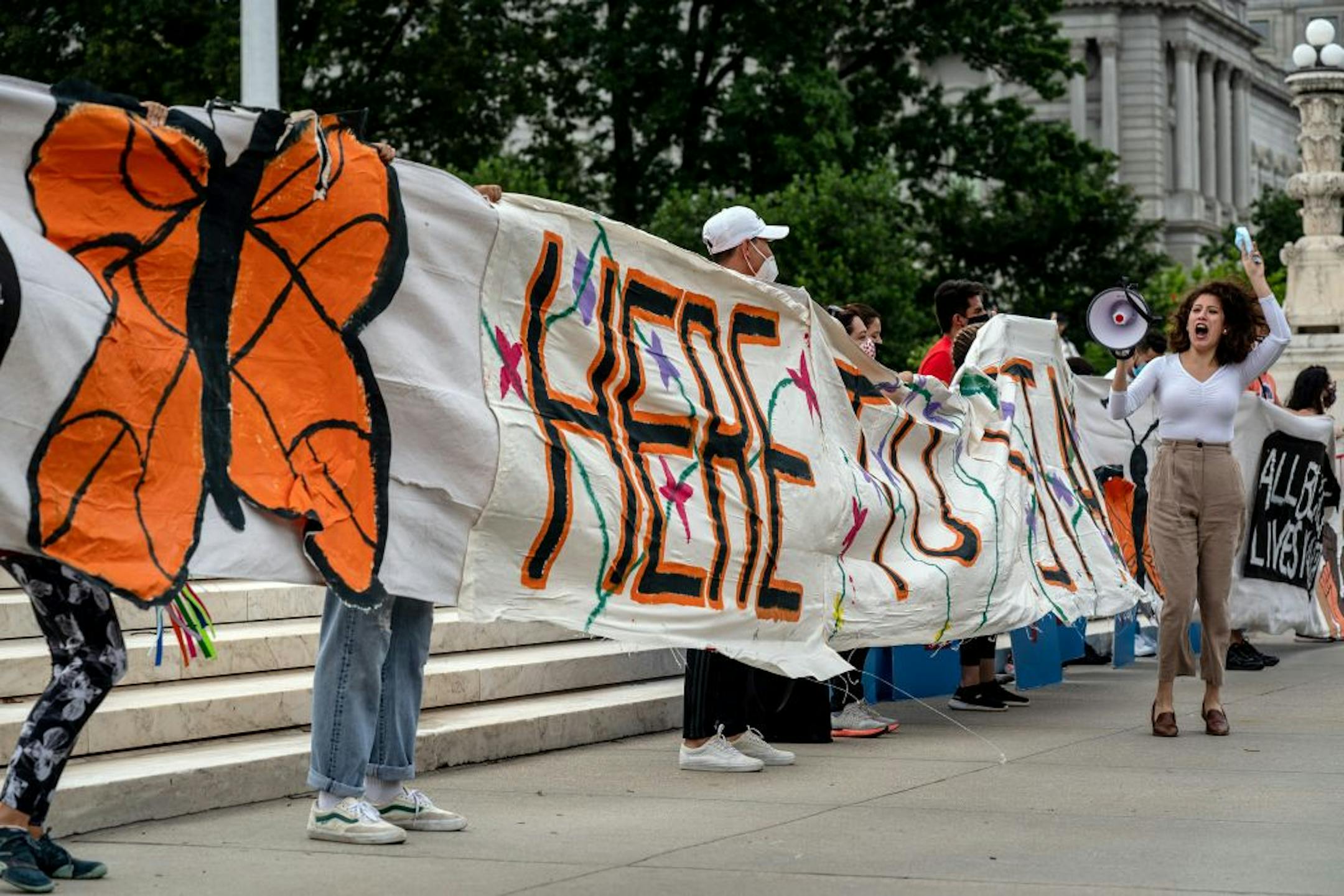 Supporters of the Deferred Action for Childhood Arrivals program demonstrate outside the Supreme Court in Washington, on Thursday, June 18, 2020, after the court ruled on the Obama-era program that protects young immigrants from immediate deportation.