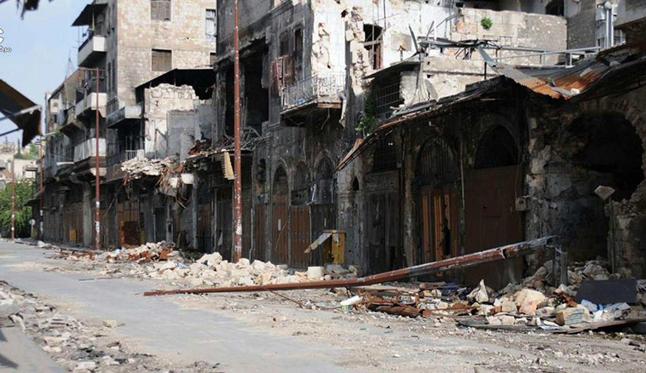 This citizen journalism image provided by Aleppo Media Center AMC which has been authenticated based on its contents and other AP reporting, shows damaged buildings during battles between the rebels and the Syrian government forces, in Aleppo, Syria, Thursday, June 13, 2013. Syria's upwardly spiraling violence has resulted in the confirmed killings of almost 93,000 people, the United Nations' human rights office said Thursday but acknowledged the real number is likely to be far higher. (AP Photo