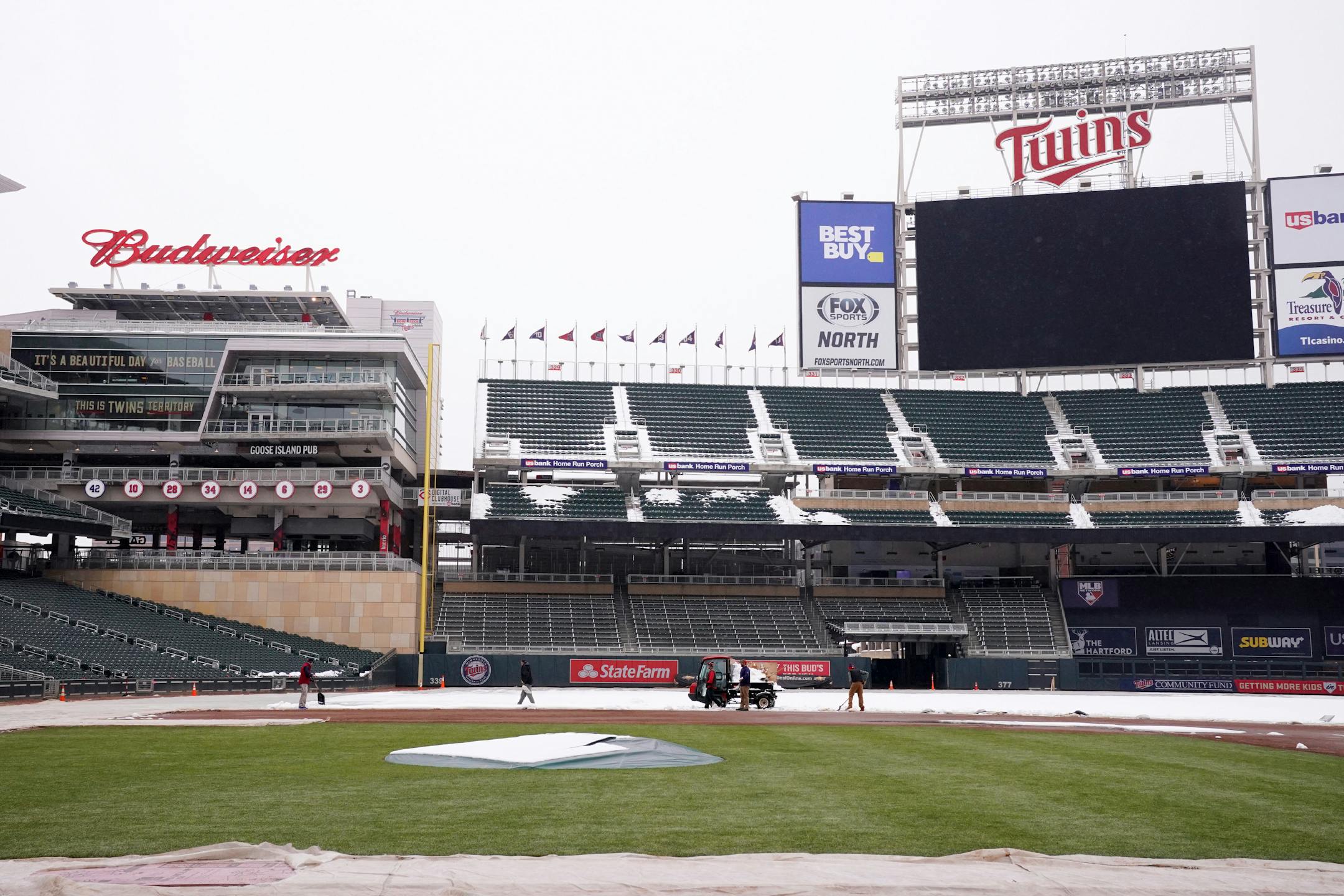 Grounds crew members worked to ready Target Field for the Twins' home opener this Thursday.