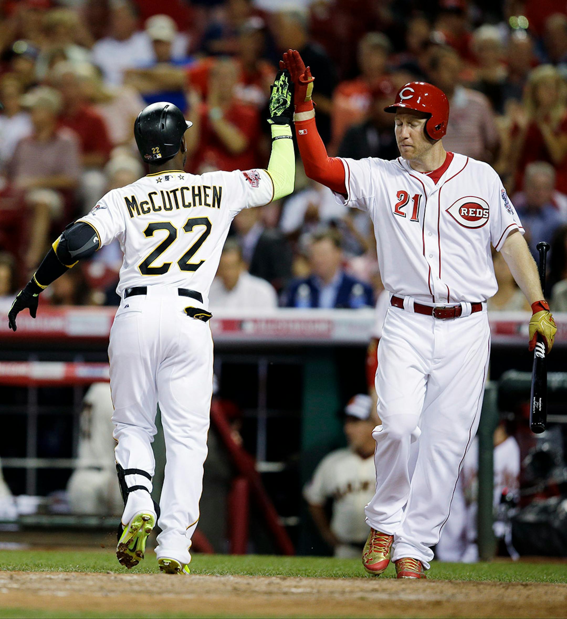 National League's Andrew McCutchen, of the Pittsburgh Pirates, is congratulated by National League's Todd Frazier, of the Cincinnati Reds, after hitting a home run during the sixth inning of the MLB All-Star baseball game, Tuesday, July 14, 2015, in Cincinnati.