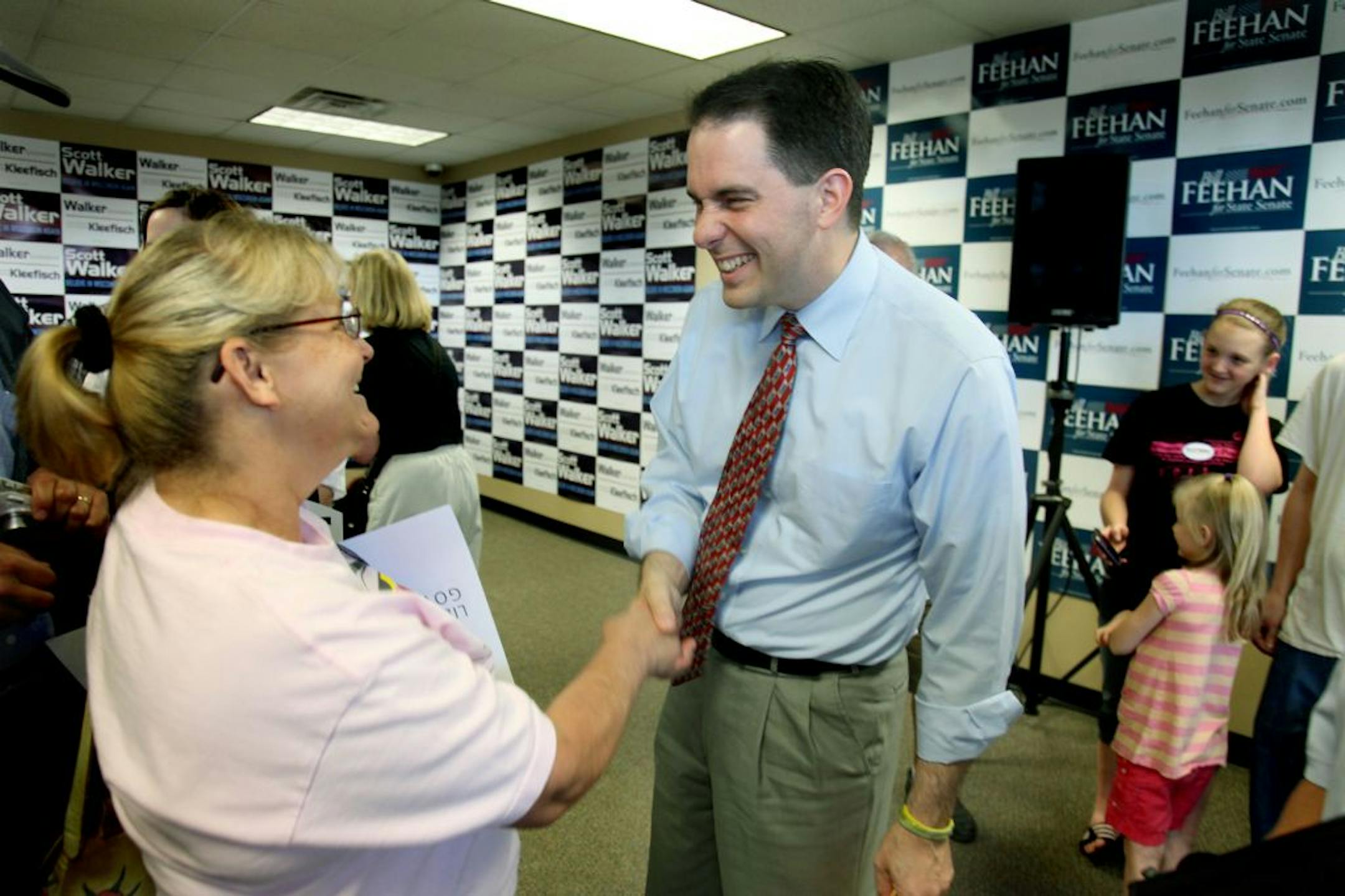 Wisconsin Governor Scott Walker was greeted by supporters at the Lacrosse, Wis., "Victory Center," Monday, May 21, 2012. Wisconsin Gov. Scott Walker is touring the state and visiting his Republican "Victory" Centers, where volunteers are manning phones and coordinating door-to-door efforts in the final weeks before the state's historical June 5 gubernatorial recall election.(ELIZABETH FLORES/STAR TRIBUNE) ELIZABETH FLORES � eflores@startribune.com