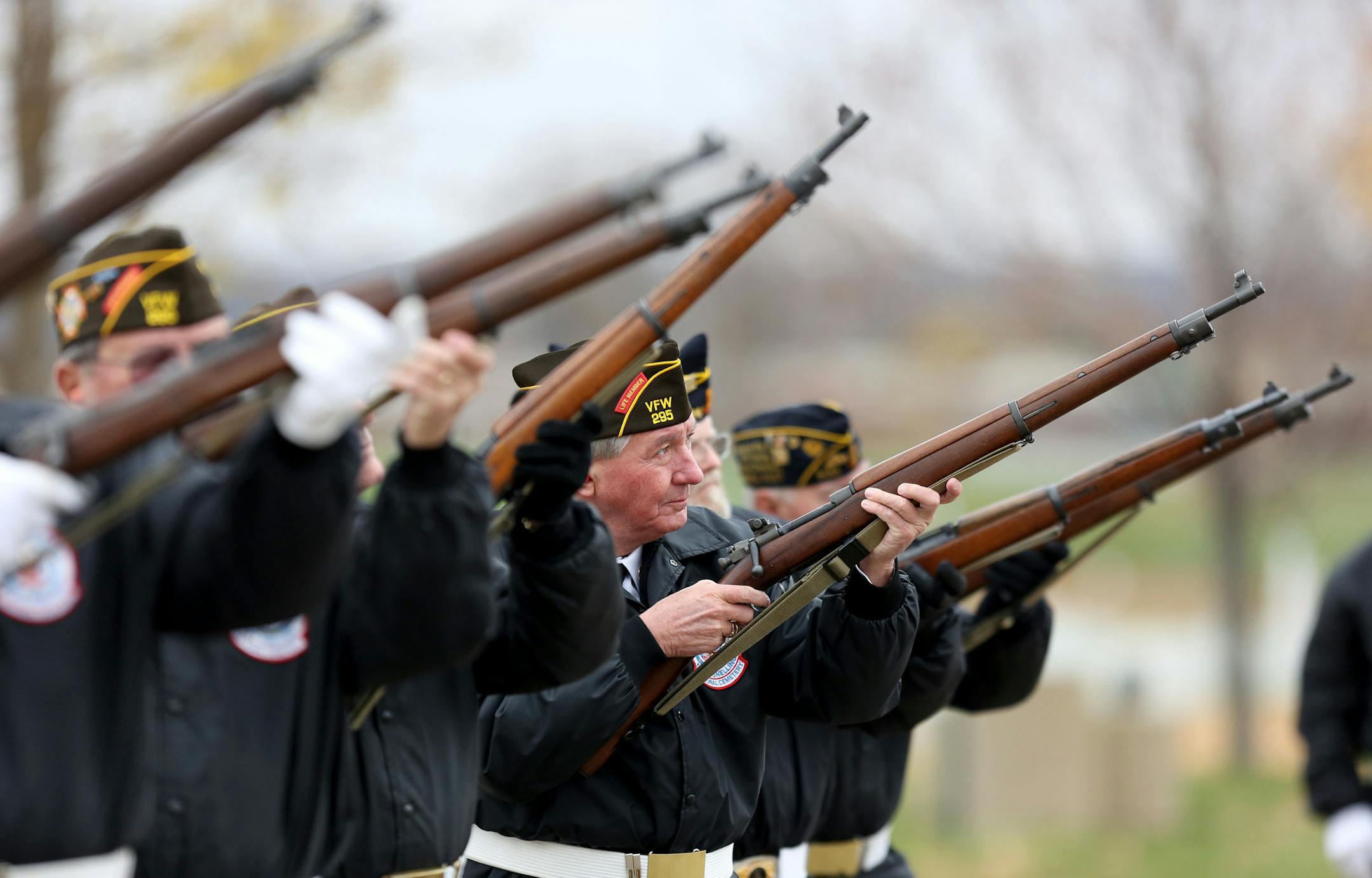 The Tuesday rifle squad shot one of three volleys during a funeral at Fort Snelling. ] (KYNDELL HARKNESS/STAR TRIBUNE) kyndell.harkness@startribune.com With the Tuesday squad of the Fort Snelling National Cemetery's Memorial Rifle Squad at Fort Snelling in Minneapolis, Min., Tuesday, October 21, 2014.