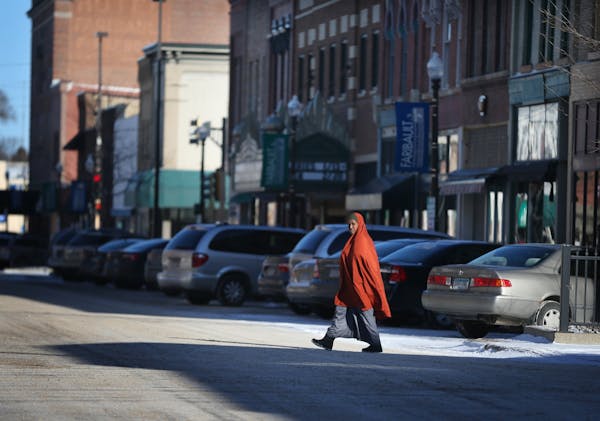 A woman walked across Central Avenue on a cold morning Wednesday Feb 1, 2017 in Faribault, MN.
