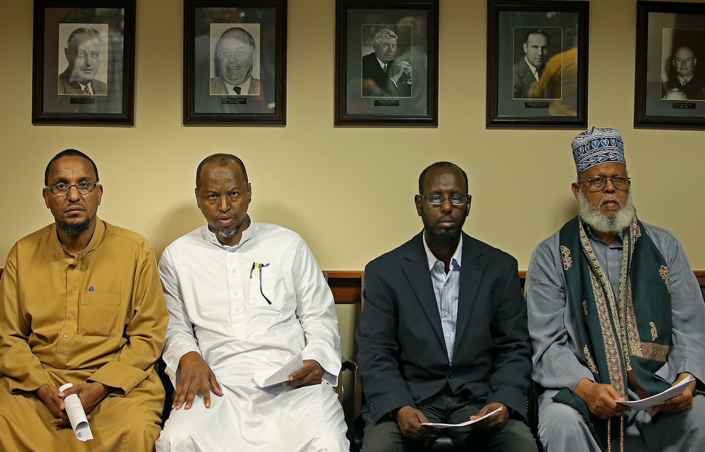 Members of the Abu Huraira Islamic Center listened as United States Attorney Andrew M. Luger announced the filing of a lawsuit against the City of St. Anthony Village for an alleged violation of the Religious Land Use and Institutionalized Persons Act of 2000, during a press conference at the United State Attorney's Office, Wednesday, August 27, 2014 in Minneapolis.