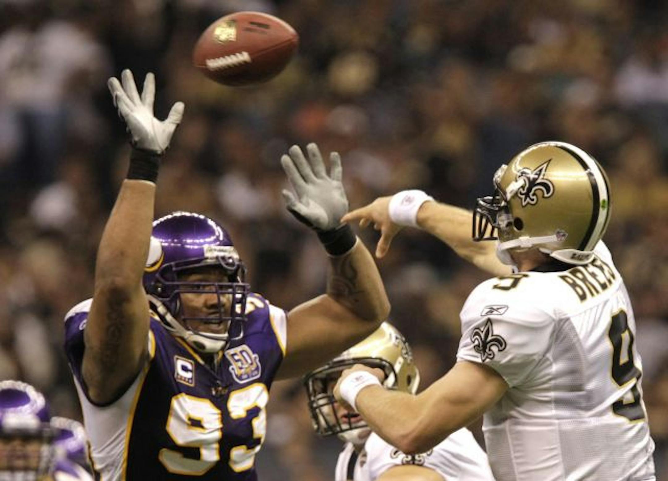 Vikings Kevin Williams pressures Saints quarterback Drew Brees in the 2nd quarter.