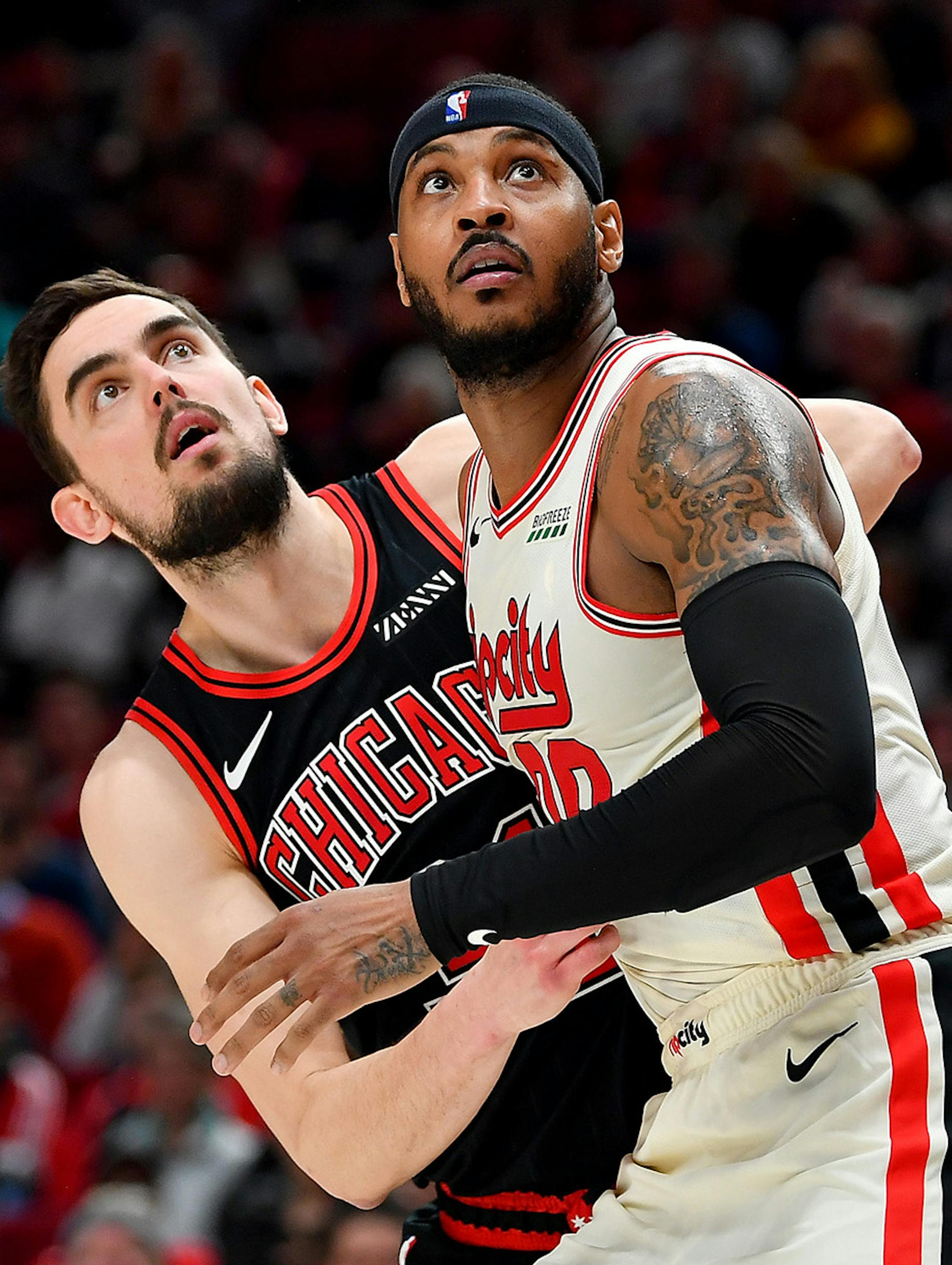 Carmelo Anthony (00) of the Portland Trail Blazers and Tomas Satoransky (31) of the Chicago Bulls battle for a rebound during the second half on Nov. 29, 2019 at the Moda Center in Portland, Ore. (Alika Jenner/Getty Images/TNS) ORG XMIT: 1504877