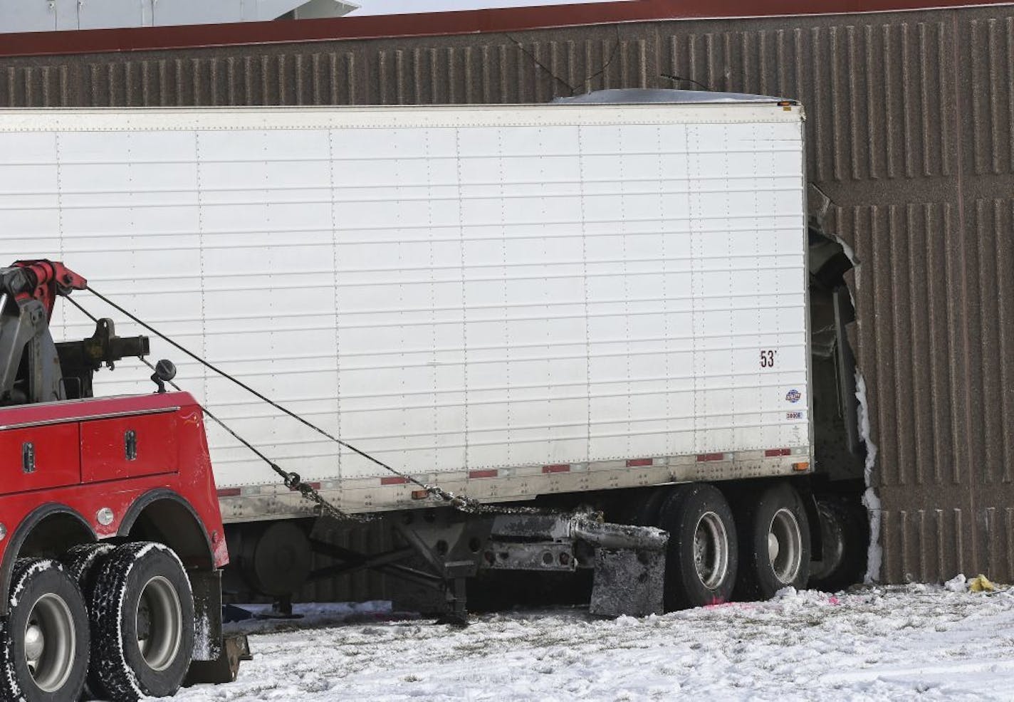 The Minnesota State Patrol investigates a two-vehicle crash Tuesday, Jan. 16, 2018, morning that sent a semi-trailer crashing into Lyle Public School from Hwy. 218 in Lyle, Minn.