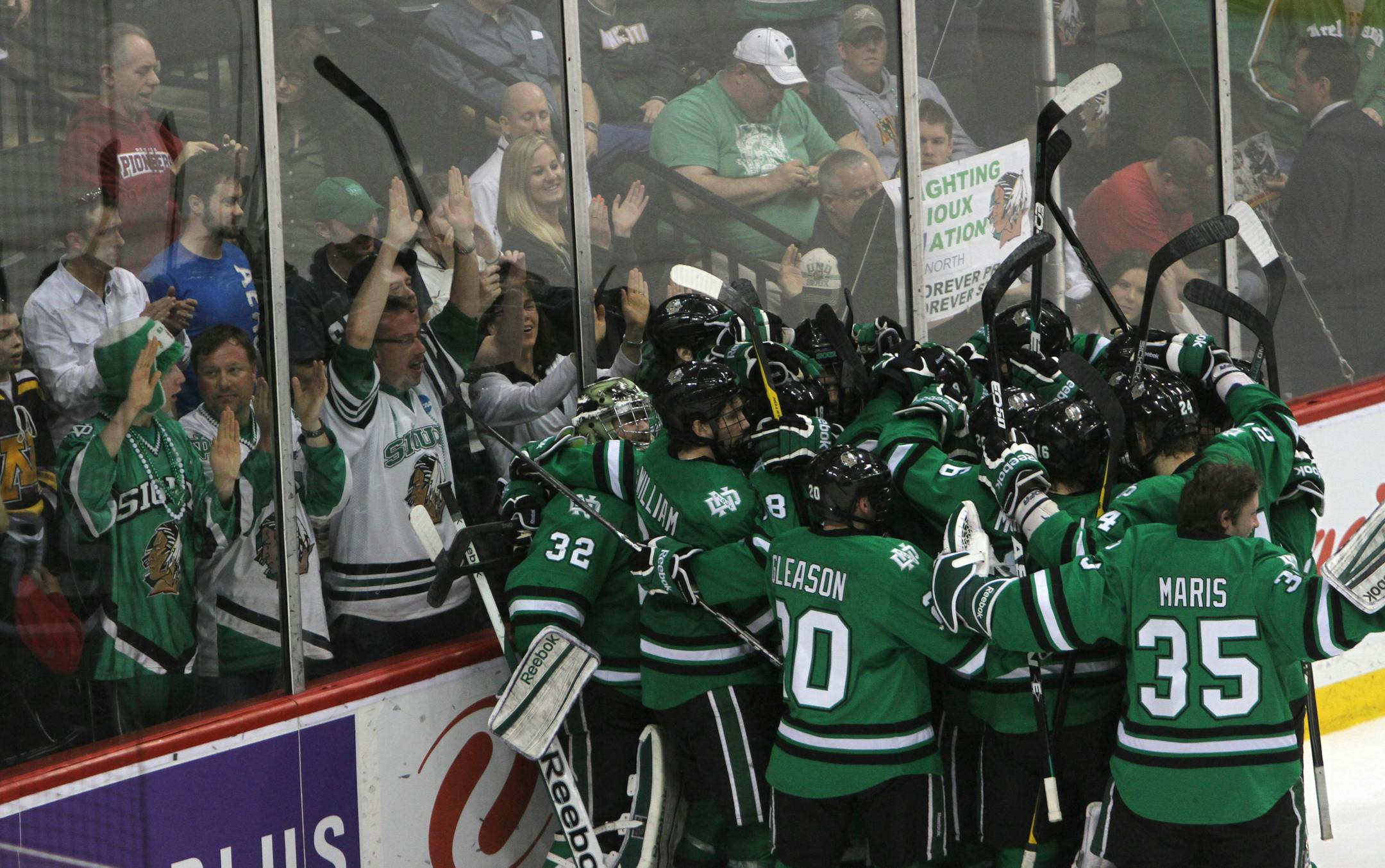 North Dakota's team and fans celebrated their victory over Denver for the championship game of the WCHA Final Five at the Xcel Energy Center in St. Paul Min., Saturday, March 17, 2012. North Dakota won 4-0. ] (KYNDELL HARKNESS/STAR TRIBUNE) kyndell.harkness@startribune.com