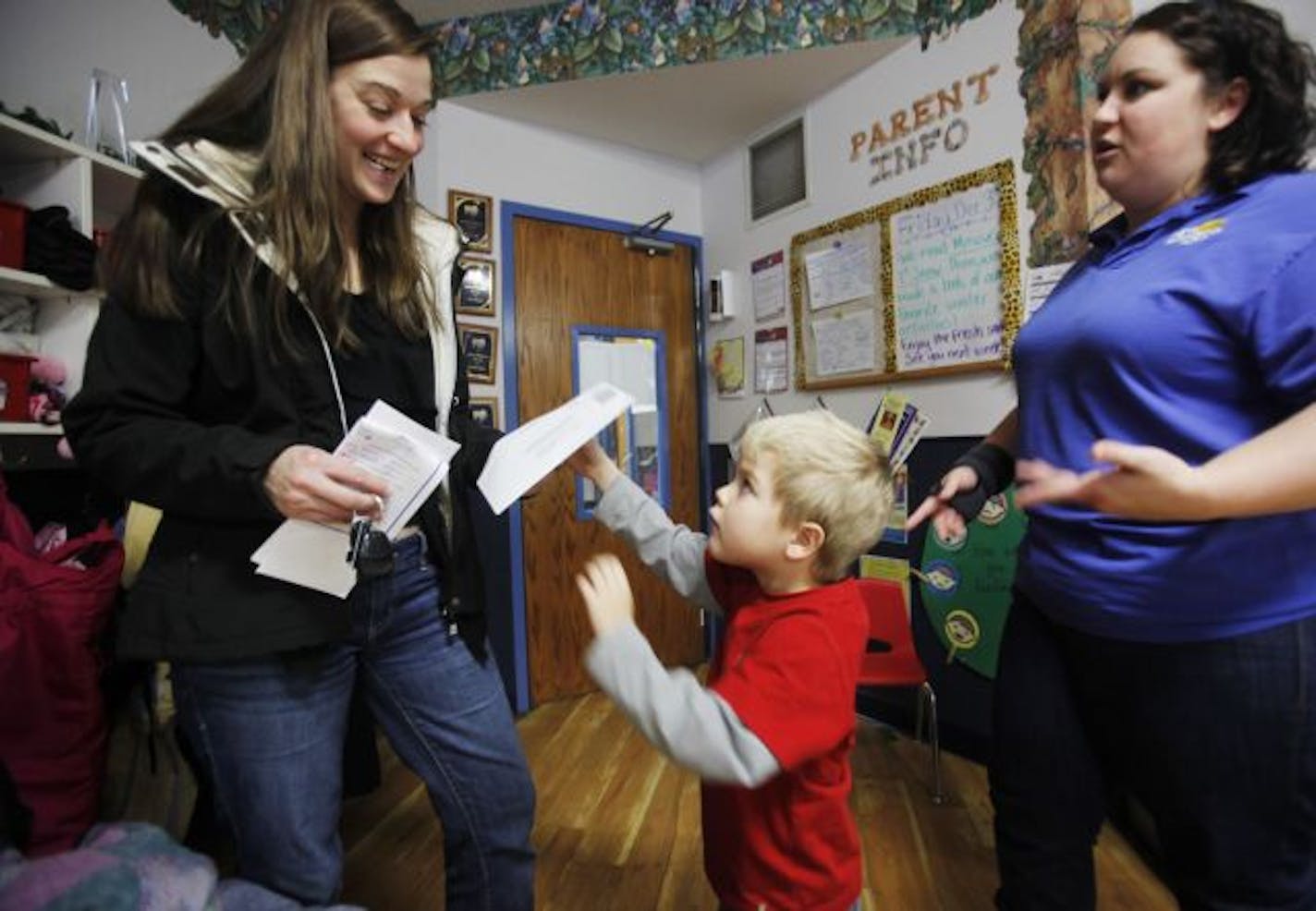 Child care authorities are beginning to tackle a long-known dilemma in Minnesota: the high cost of center-based child care. Authorities have always worried about lowering costs in a way that could sacrifice quality, but fear that the cost issue has only gotten worse due to the recession. The high cost may be preserving quality, but now it also might be pricing too many families out of the market.
In this photo:] Landon Herman, 4, shows his mom Melissa, left, his daily report from his pre-kinderg