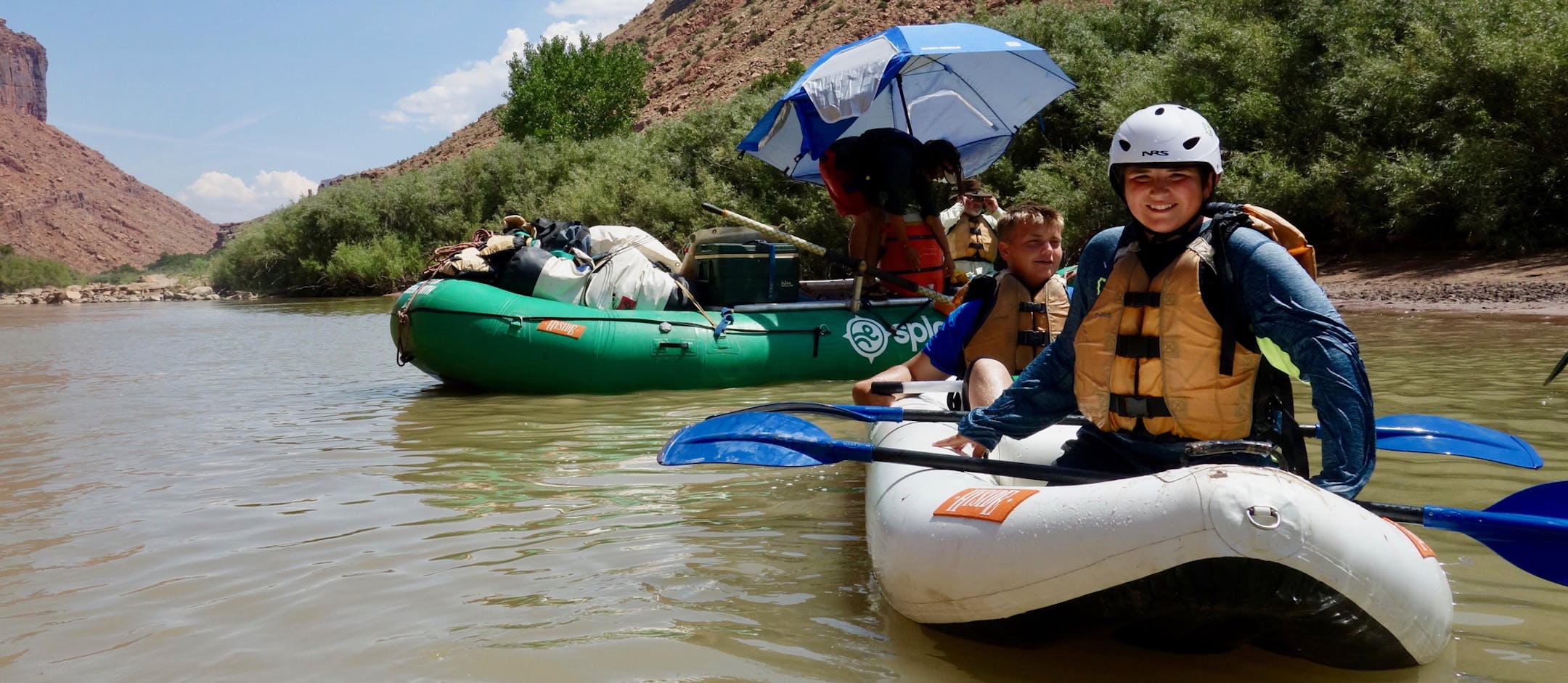 Chayse Buchta (left) and Justin Buchta (right) after navigating the Duckie inflatable kayak through a set of rapids.