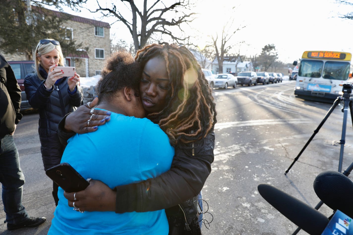 Dora Hill reunites with her daughter Jania Kloeppel, 16, outside of Patrick Henry HS during a lockdown. They were both inside the school in separate places when a code red was called.