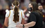 Minnesota Golden Gophers head coach Lindsay Whalen gave a pat on the back to Minnesota Golden Gophers guard Sara Scalia (14) after the loss to the Ind