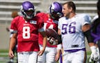 Center Garrett Bradbury, right, talked with Vikings quarterback Kirk Cousins during training camp in August. Bradbury agreed to a three-year contract 