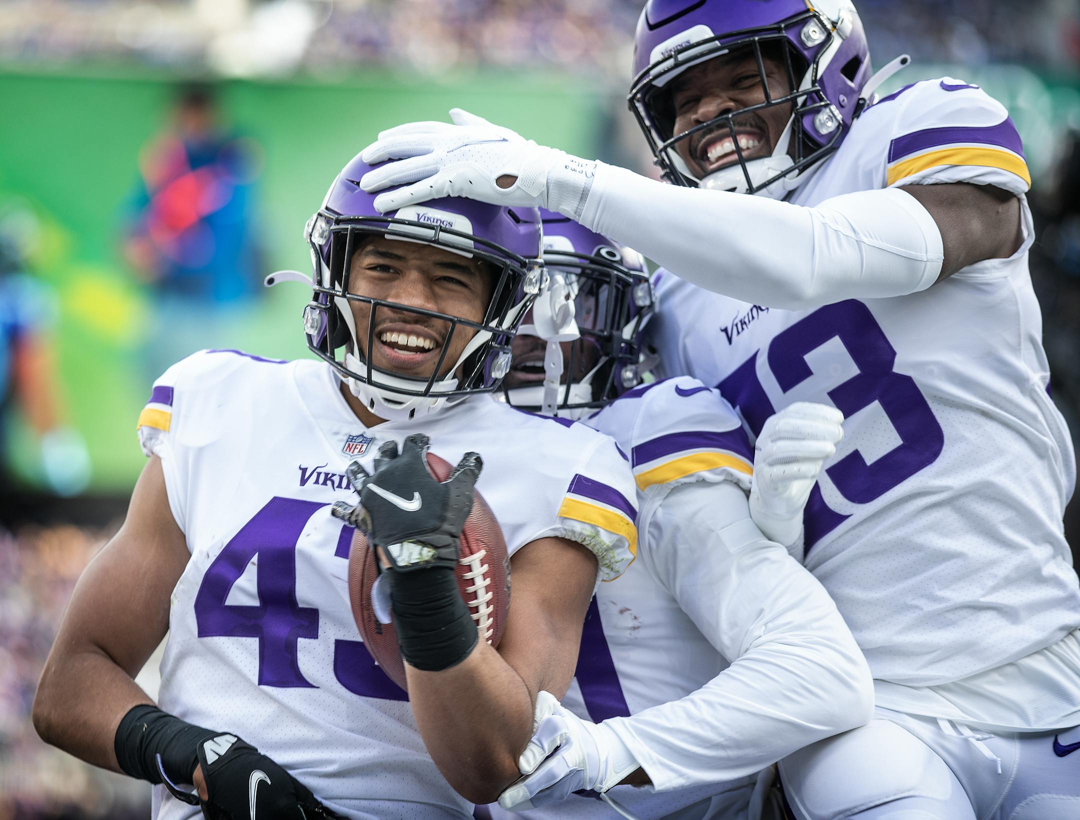 Minnesota Vikings cornerback Camryn Bynum (43), celebrates his 2nd quarter interception with Kris Boyd (29),  and Xavier Woods (23) in Baltimore.