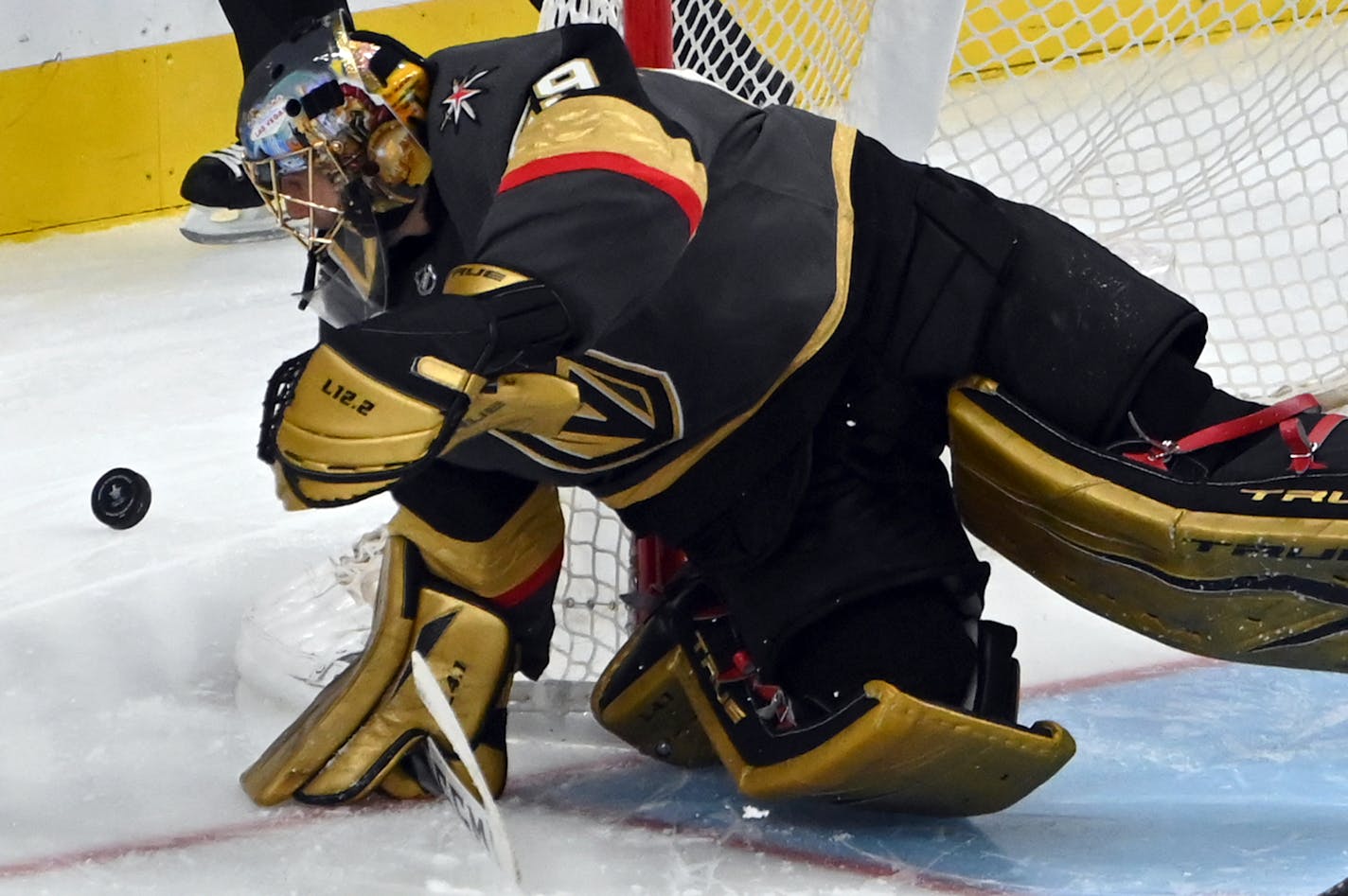 Vegas Golden Knights goaltender Marc-Andre Fleury (29) defends his goal against the Minnesota Wild during the first overtime period of Game 1 of a first-round NHL hockey playoff series Sunday, May 16, 2021, in Las Vegas. (AP Photo/David Becker)