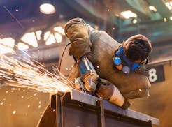 A young man welding with protective goggles. (Fotolia/TNS) ORG XMIT: 1189919