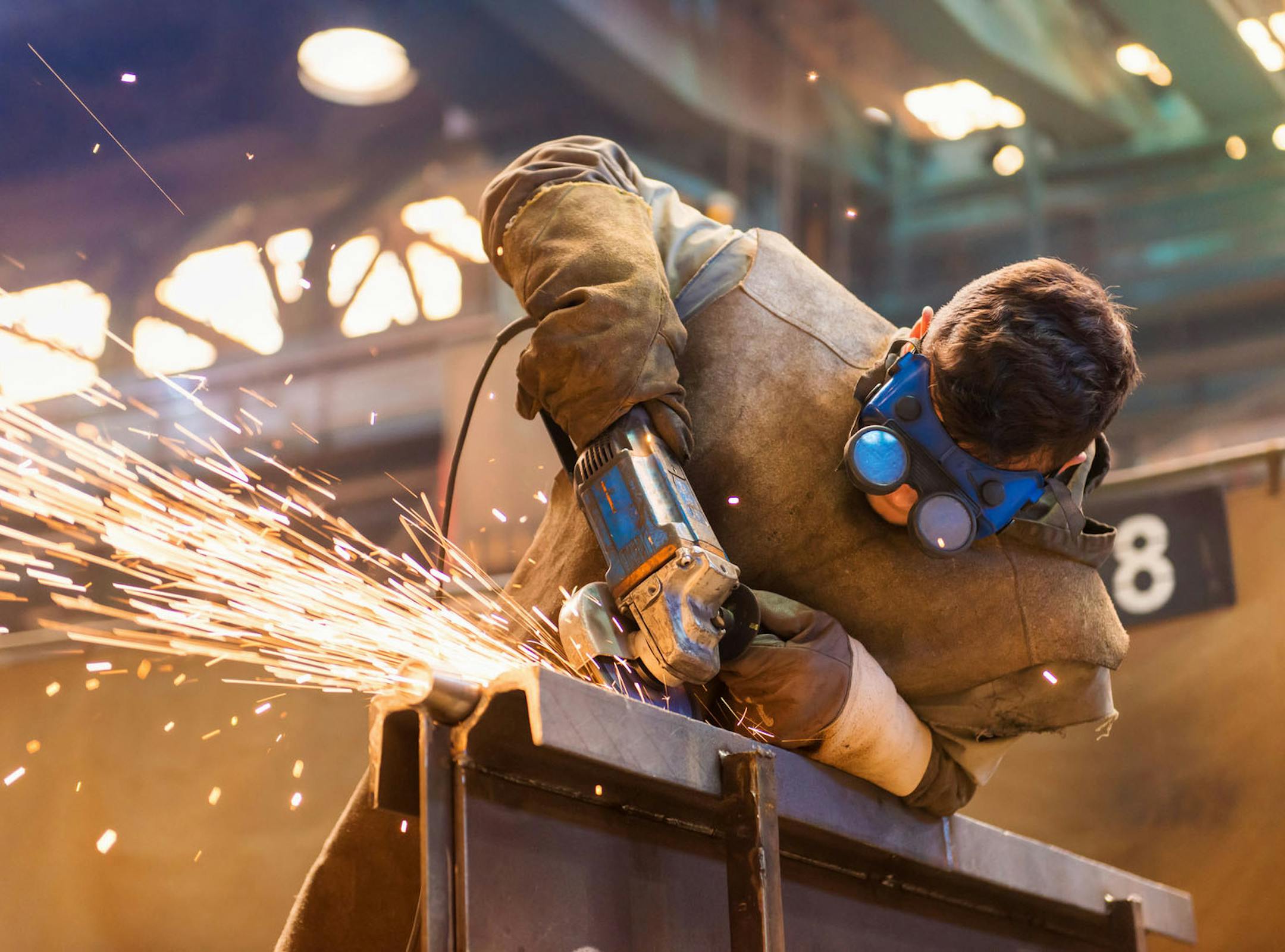 A young man welding with protective goggles. (Fotolia/TNS) ORG XMIT: 1189919