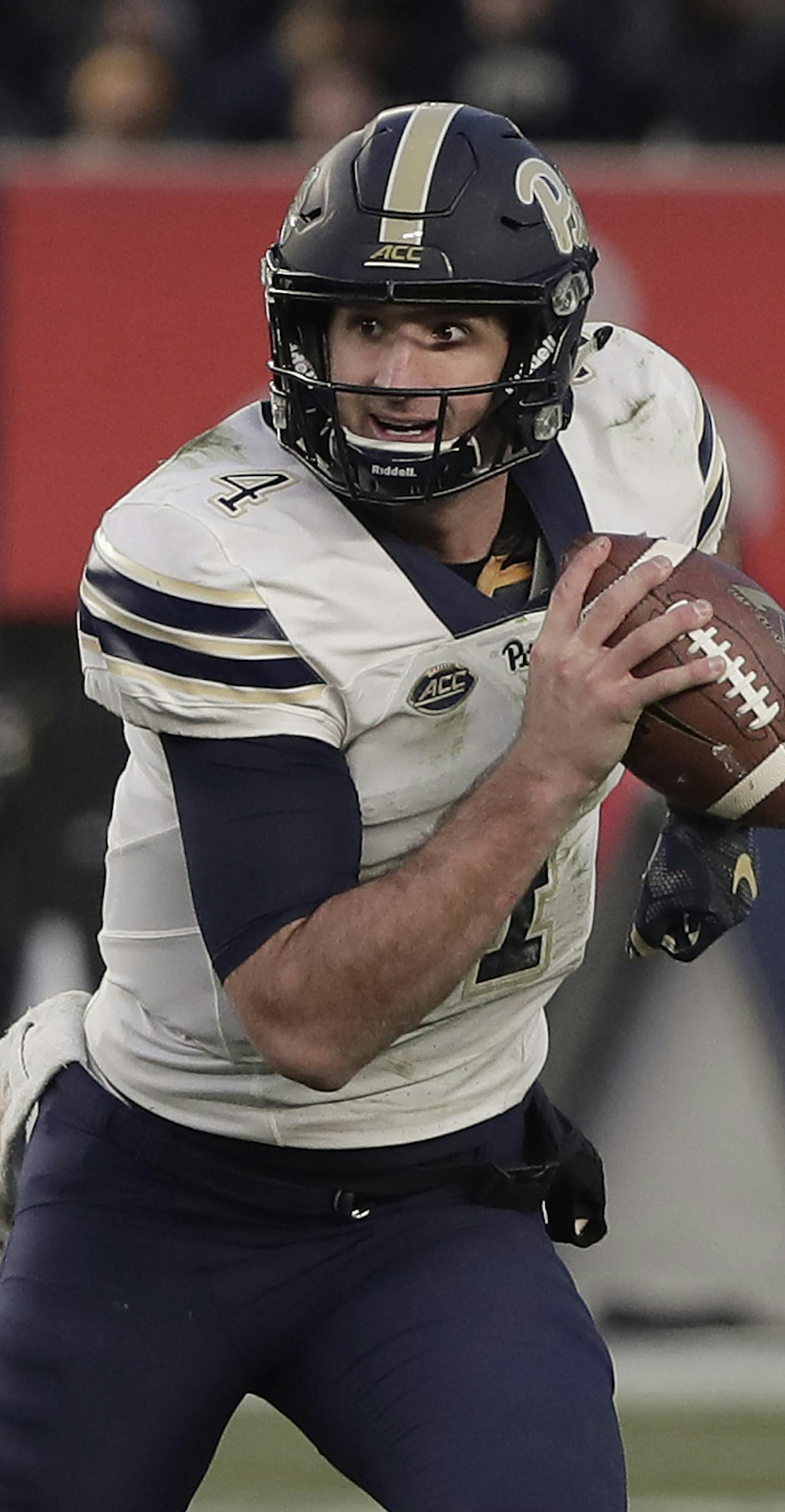 ]Pittsburgh quarterback Nathan Peterman (4) rolls out of the pocket against the Northwestern during the Pinstripe Bowl NCAA college football game, Wednesday, Dec. 28, 2016, in New York. (AP Photo/Julie Jacobson) ORG XMIT: NYJJ