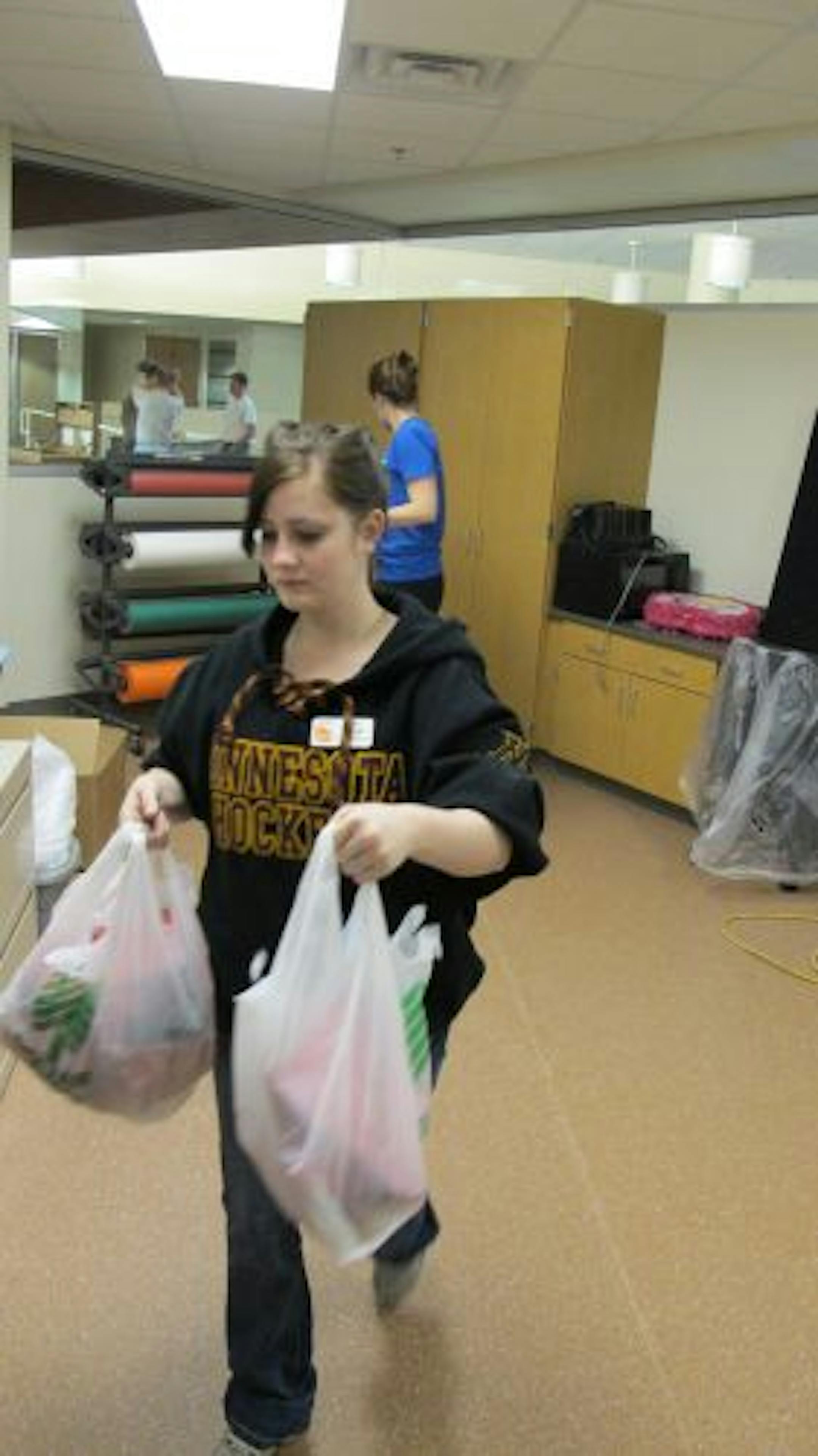 Photo by Tim HarlowWorkers put the final touches on a new multi-million dollar student center at Century College in White Bear Lake. The center will be in the space of the former library, which moved to a new space two years ago. The new center will have a coffee shop, stage, games and student government offices.