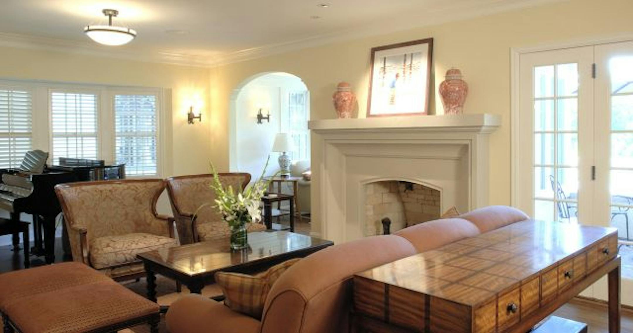 The new limestone fireplace surround is in keeping with the classical style of the house, but gives the livingroom a needed update.