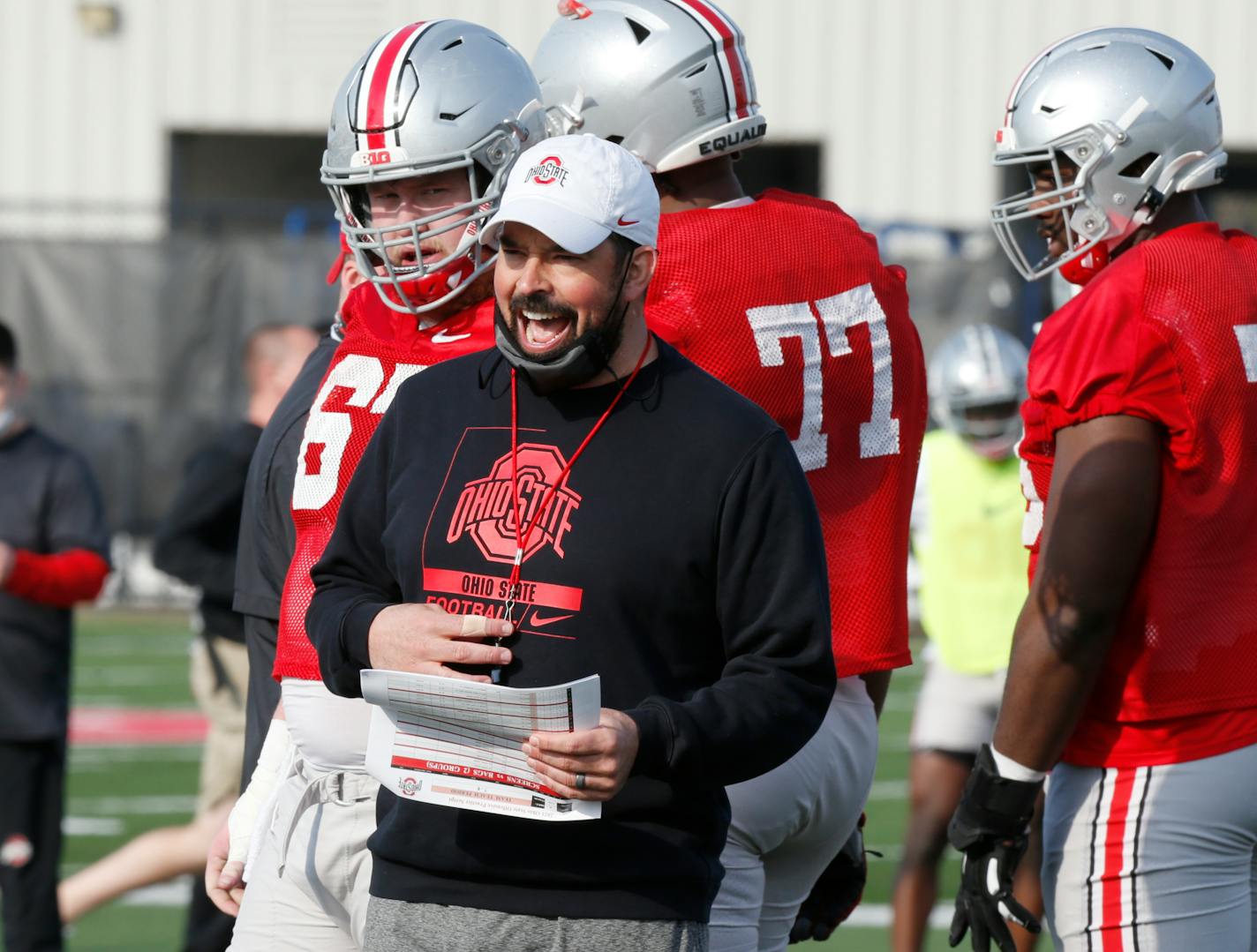 FILE - Ohio State coach Ryan Day is seen during an NCAA college football practice in Columbus, Ohio, in this Monday, April 5, 2021, file photo. Third-year Ohio State coach Ryan Day opens a preseason camp for the first time without a good idea of who will be the starting quarterback. "If I did, I'd probably sleep a little better right now, but I don't," said Day, who is 23-2 in his first two seasons since taking over for Urban Meyer. (AP Photo/Paul Vernon, File) ORG XMIT: NY155