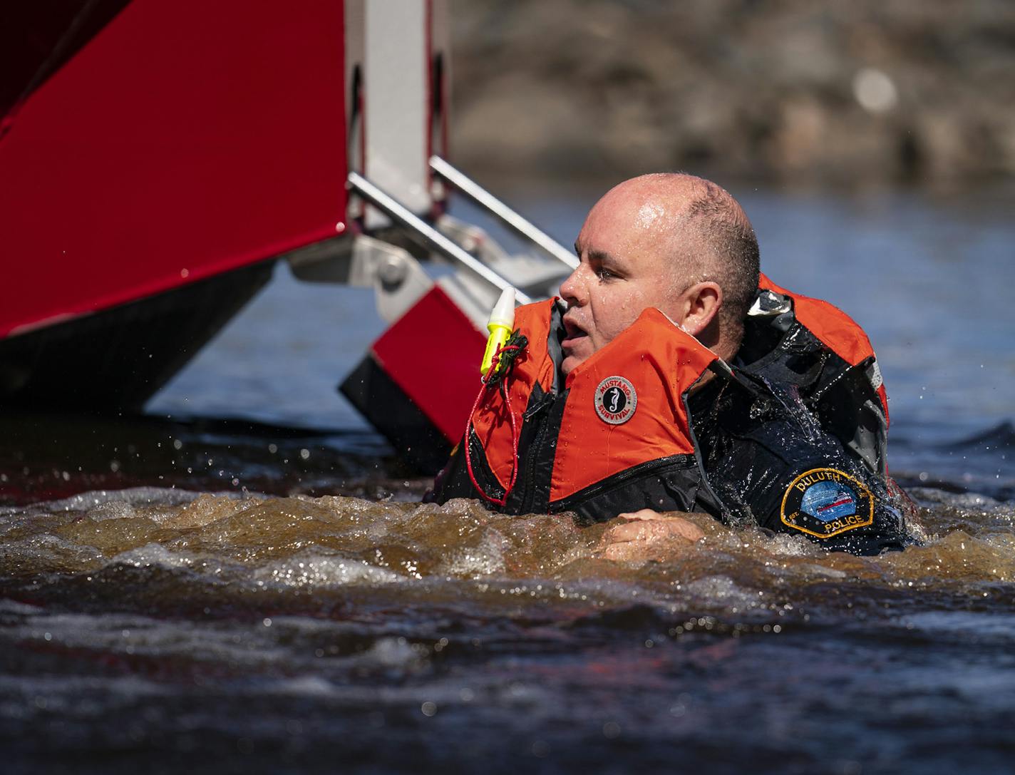 "A little bit of pain for a great cause," Tusken said before he leaped off a fire department boat into Lake Superior.