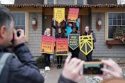 Students from iMatter, a youth-driven organization focused on climate change, posed with signs after recording a message at Rep.-elect Dean Phillips' 