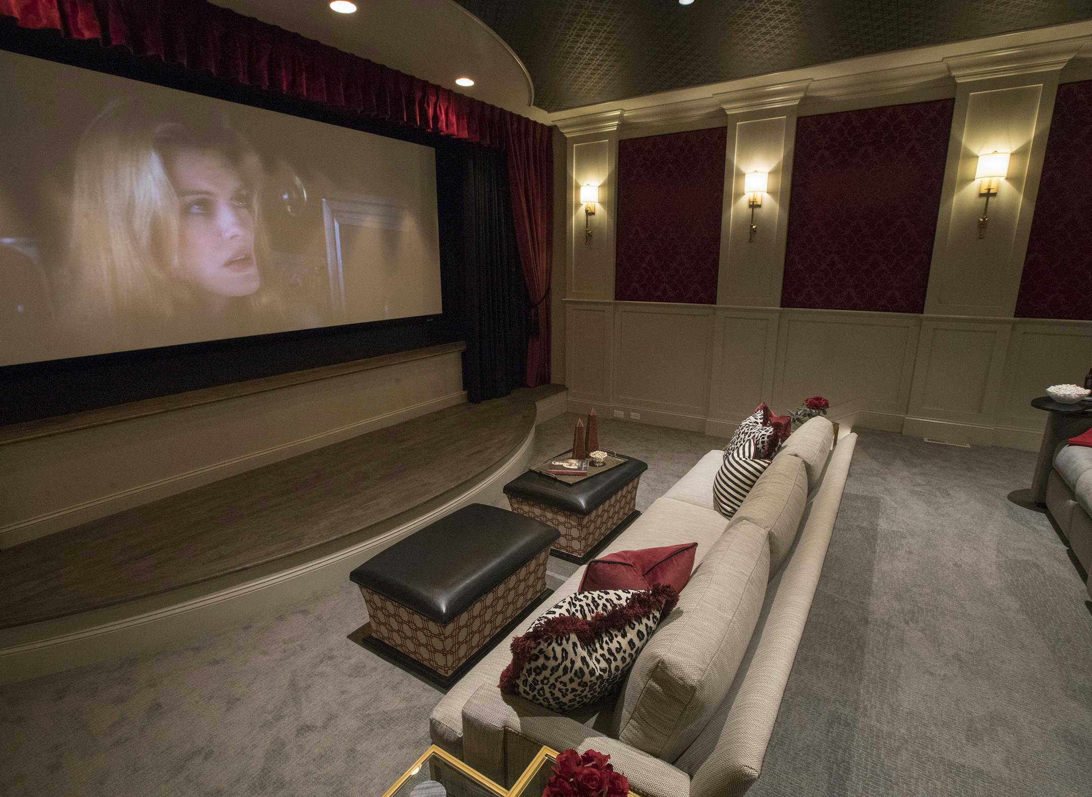 The theater room, inspired by old Hollywood glam, was designed by Jennifer Austin-McGrath and Rod Edman.