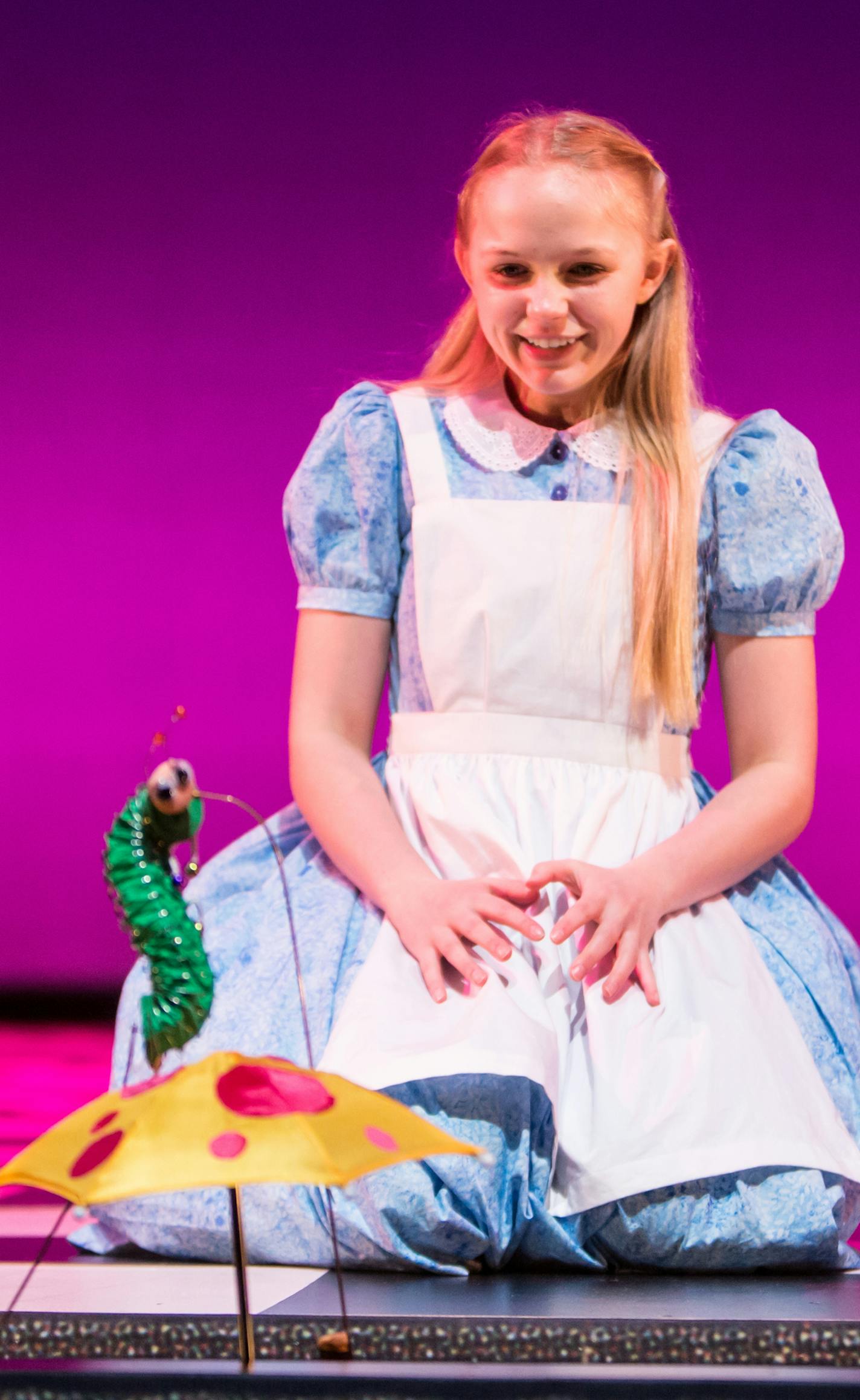 Anna Evans plays Alice in "Alice in Wonderland" at Children's Theatre Company.