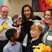 Judge Shereen Askalani smiled as she held 15-month-old Charlotte and her twin brother Titus after they were adopted by Jenny, right, and Cullen Hall, 