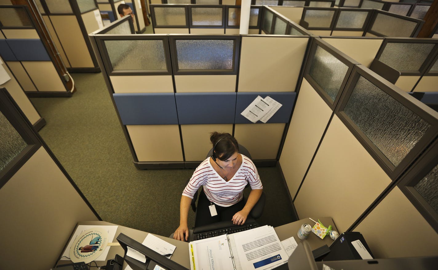 Emily Joyce worked in his cubicle at the MNsure call center on it's first day in St. Paul, Minn., on Tuesday, September 3, 2013. There were 27 representatives taking calls. ] (RENEE JONES SCHNEIDER &#x2022; reneejones@startribune.com)