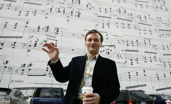 Stephen Hough in from of the Schmitt Music mural in downtown Minneapolis.