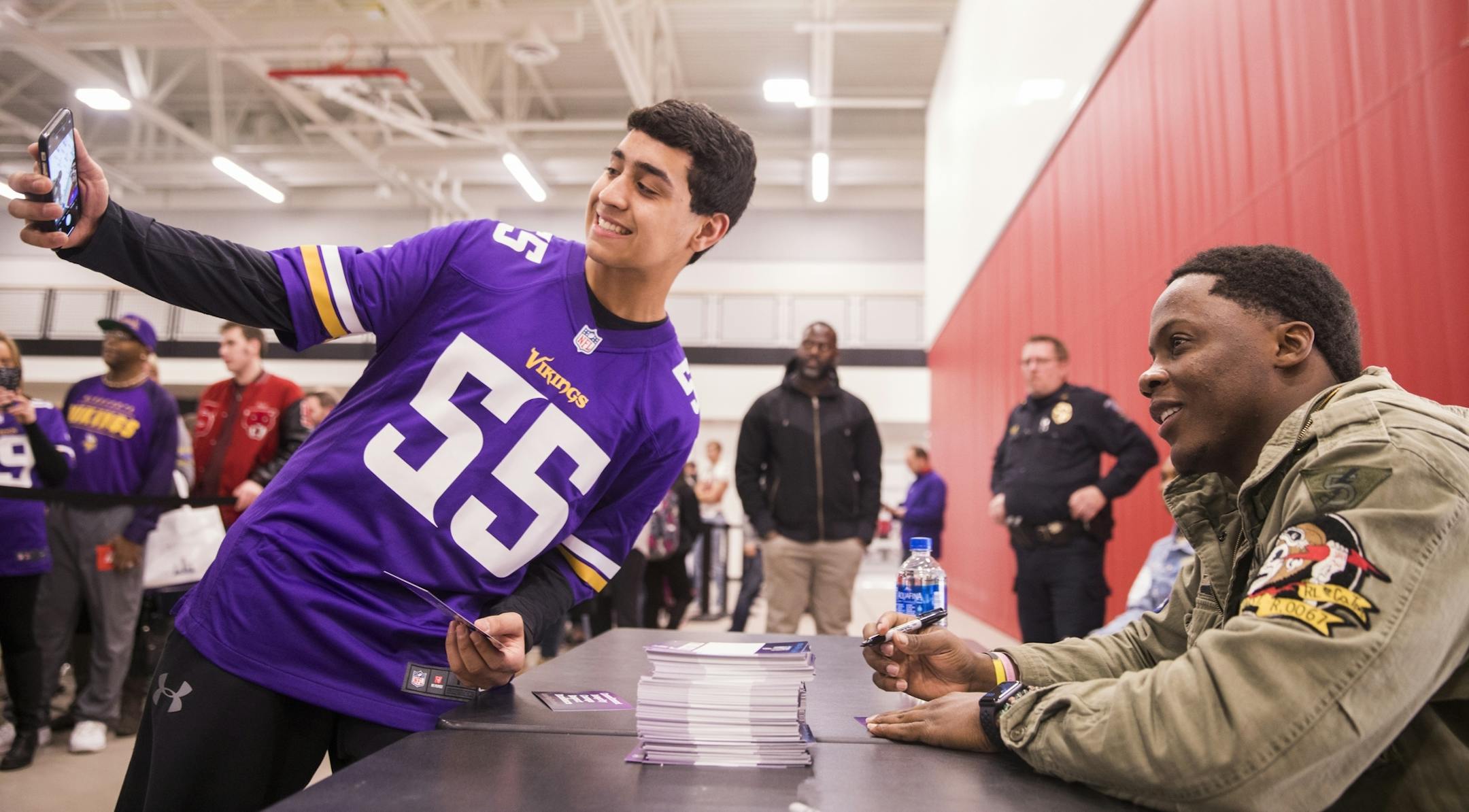 Vijay Relan, 15, of Shakopee takes a selfie with Teddy Bridgewater during an autograph signing session.