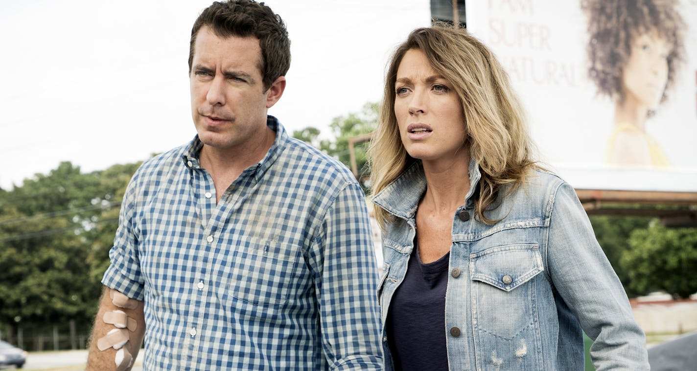 Jason Jones and Natalie Zea in "The Detour" on TBS.