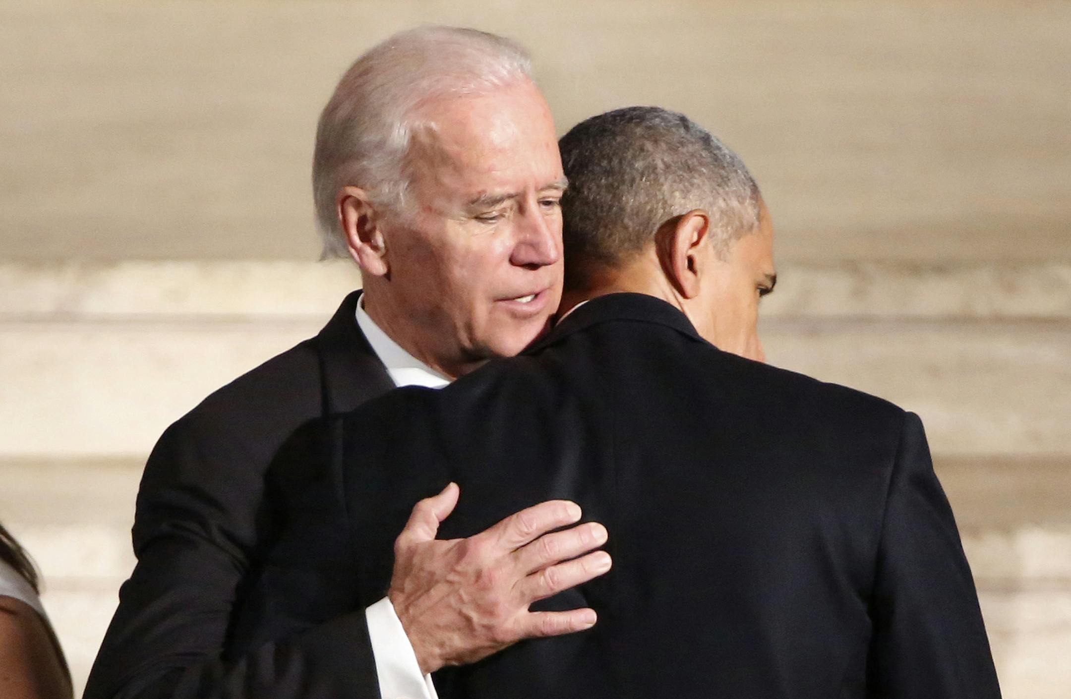 President Barack Obama hugs Vice President Joe Biden during funeral services for Biden's son, Beau Biden, Saturday, June 6, 2015, at St. Anthony of Padua Church in Wilmington, Del. (Yuri Gripas/Pool Photo via AP) ORG XMIT: MIN2015060614020231