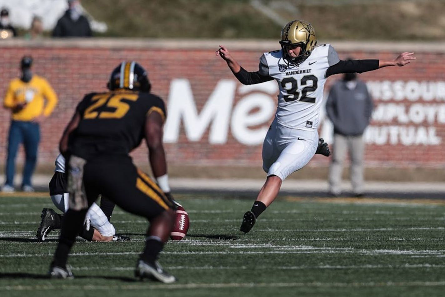 Vanderbilt's Sarah Fuller (32) kicks off in the second half against Missouri at Memorial Stadium in Columbia, Missouri, on Saturday, Nov. 28, 2020. Fuller, a senior goalkeeper on Vanderbilt's SEC championship soccer team, became the first woman to play in a Power 5 NCAA football game.