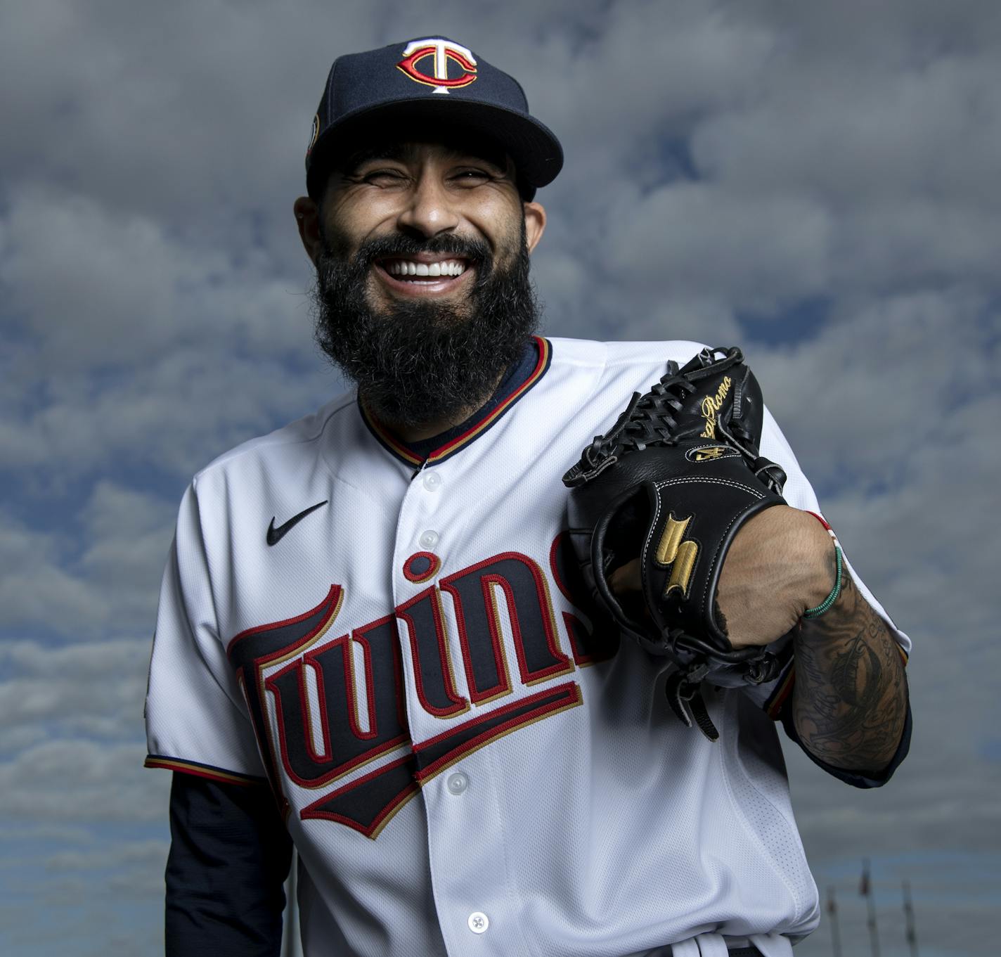 Don't let Sergio Romo's infectious smile fool you. The Twins reliever is a fierce competitor on the mound.