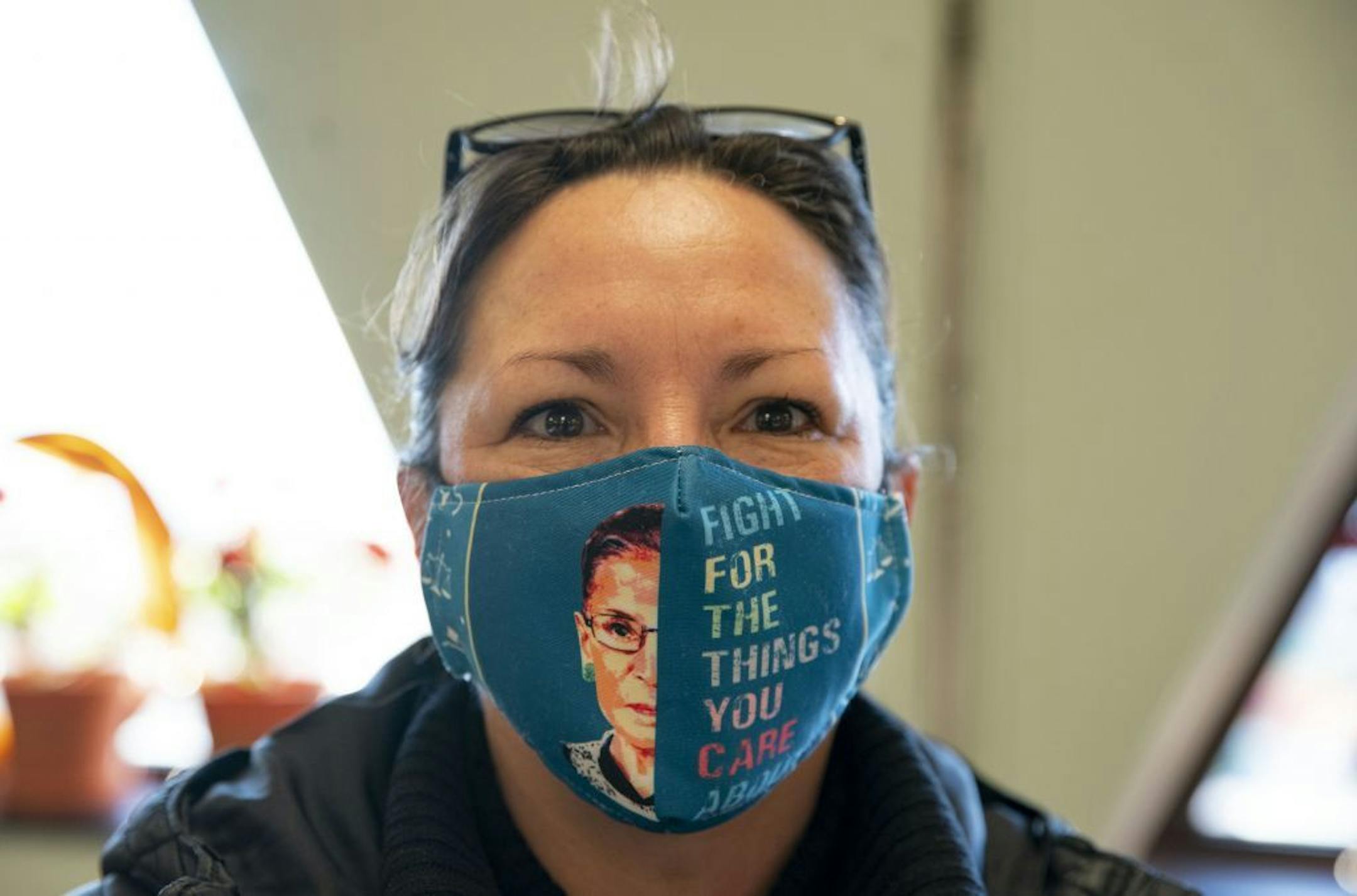 Holly Hakkila donned a mask featuring the image of late Supreme Court Justice Ruth Bader Ginsberg as she voted at First United Methodist Church in Duluth on Tuesday morning.