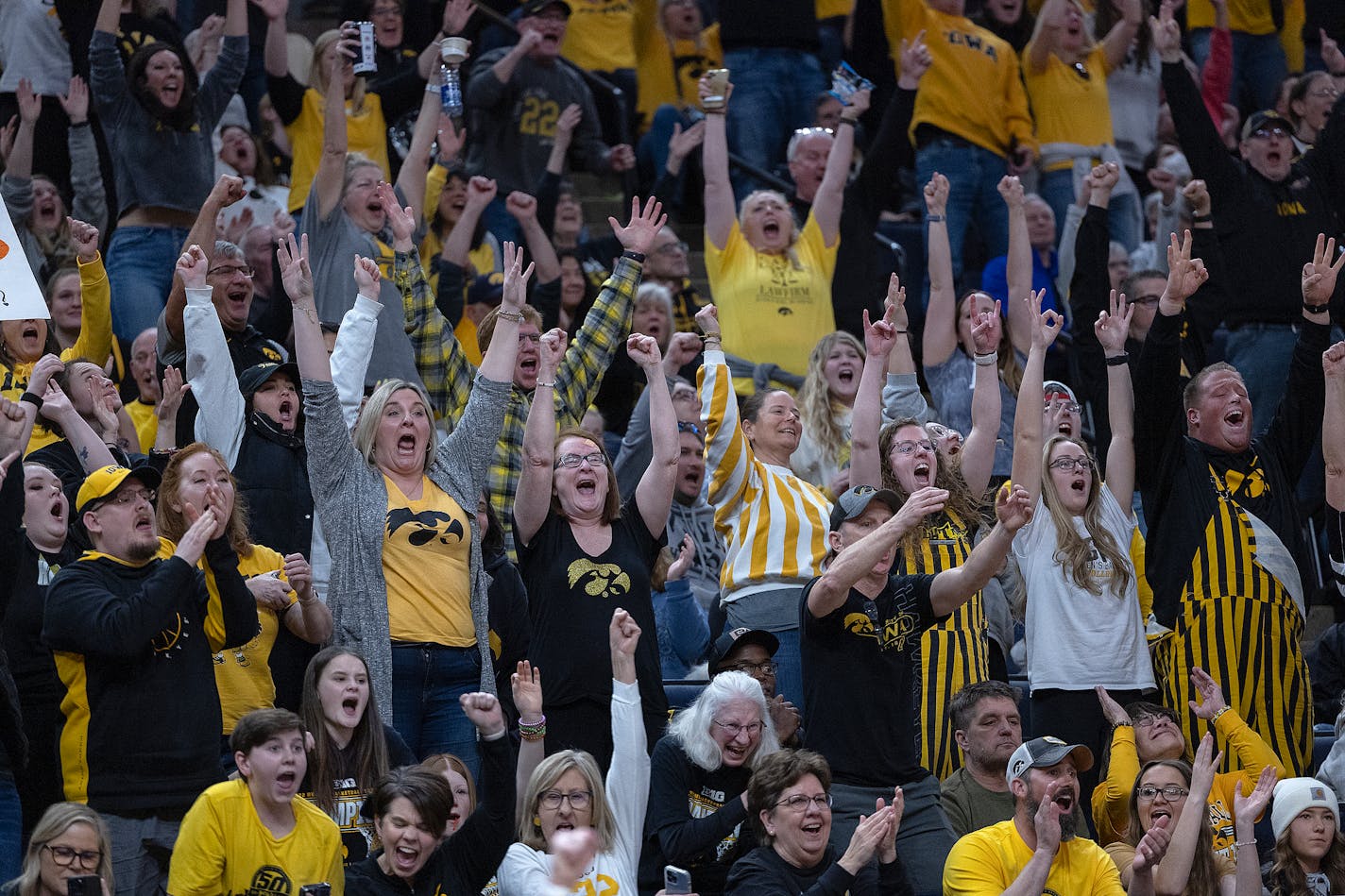 Iowa Hawkeye celebrate a there-pointer by Iowa Hawkeyes' guard Caitlin Clark (22) during the second half of the Big Ten women's Championship basketball game on Sunday, March 5, 2023 at Target Center in Minneapolis, MN. ] Elizabeth Flores • liz.flores@startribune.com