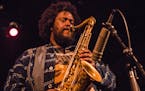 FILE -- Kamasi Washington plays at the Bearsville Theater in Woodstock, N.Y., Aug. 19, 2015. Washington, a tenor saxophonist whose emergence out of a 