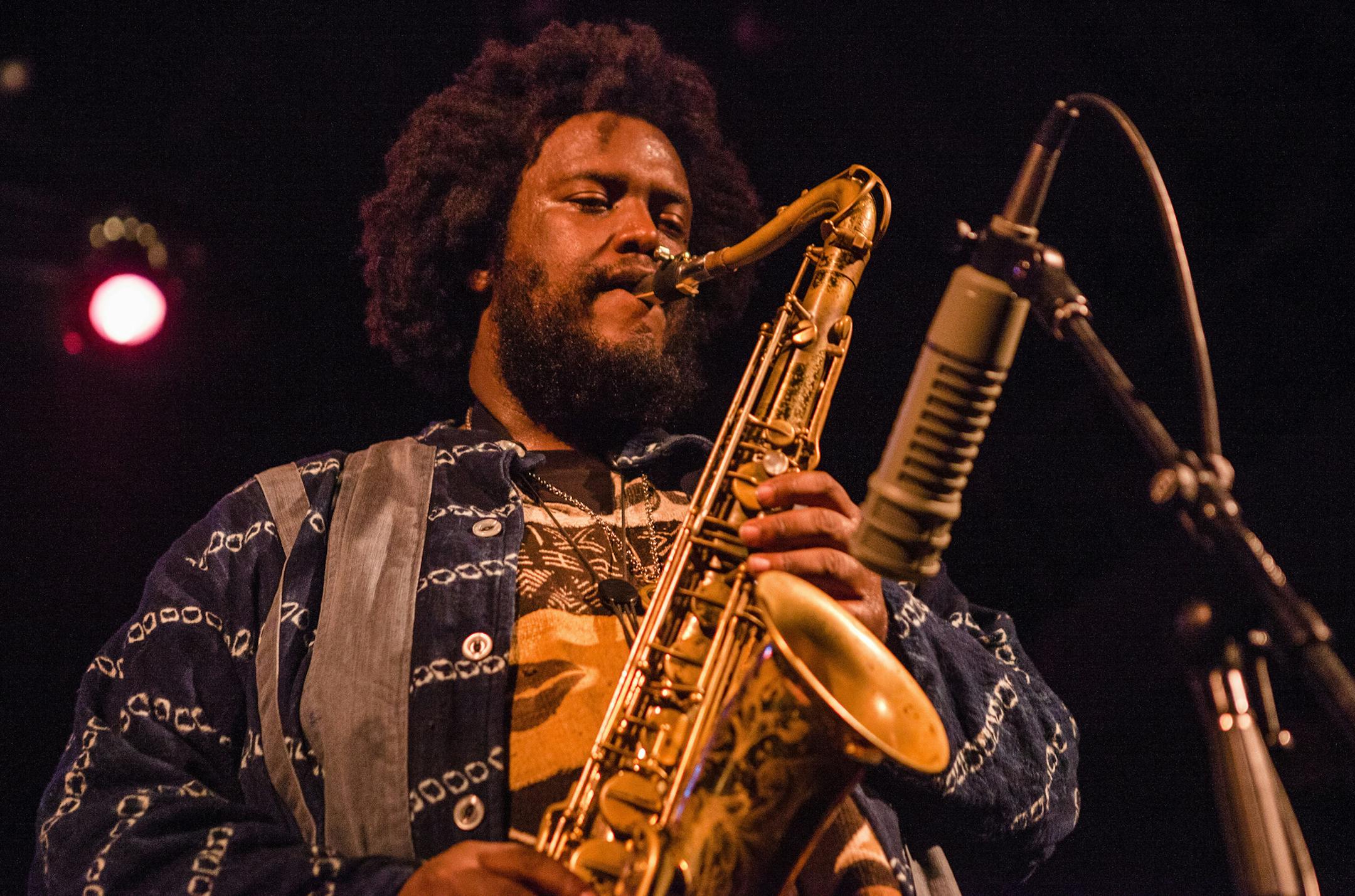 FILE -- Kamasi Washington plays at the Bearsville Theater in Woodstock, N.Y., Aug. 19, 2015. Washington, a tenor saxophonist whose emergence out of a energetic but localized Los Angeles scene was one of the yearís best music stories, released a three-disc debut album, ìThe Epic,î in 2015. (Lauren Lancaster/The New York Times) ORG XMIT: XNYT48