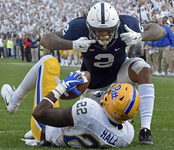 Penn State's Marcus Allen (2) looks down at Pitt's Darrin Hall after tackling him in the end zone for a safety in the fourth quarter on Saturday, Sept