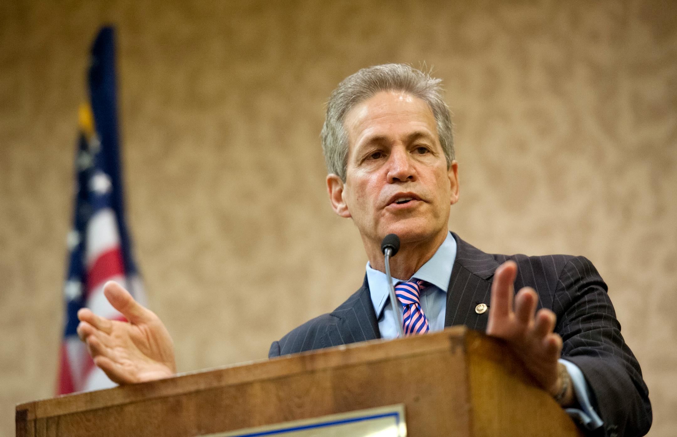 In this file photo, former Minnesota Senator Norm Coleman spoke to the Minnesota delegation Wednesday, August 29, 2012 before the Republican National Convention.