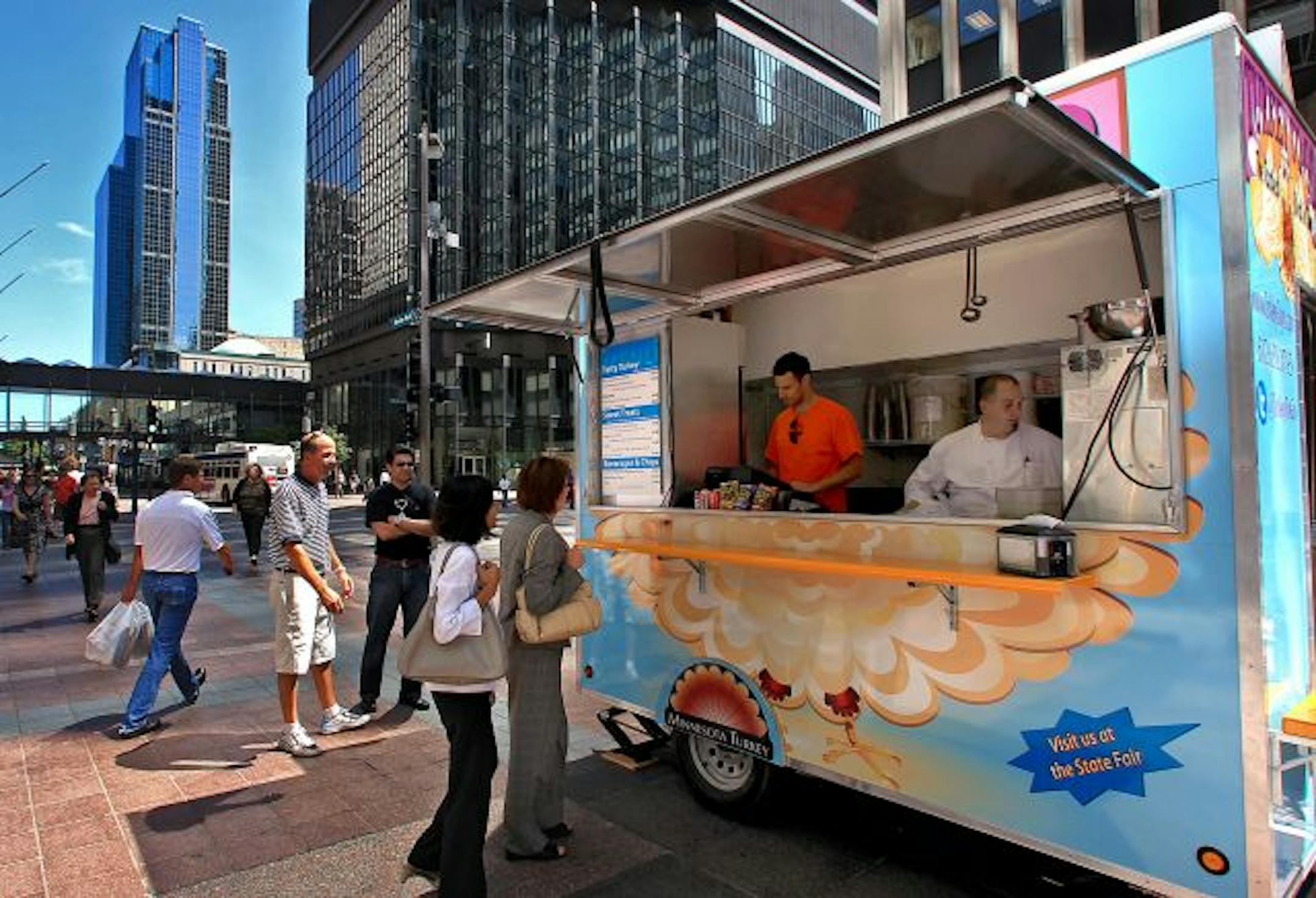Nicollet Mall already has food carts. Here, Drew Levin (left) and chef Tim Malloy catered to a lunch crowd along Nicollet Mall in downtown Minneapolis from a new "Turkey To Go" trailer.